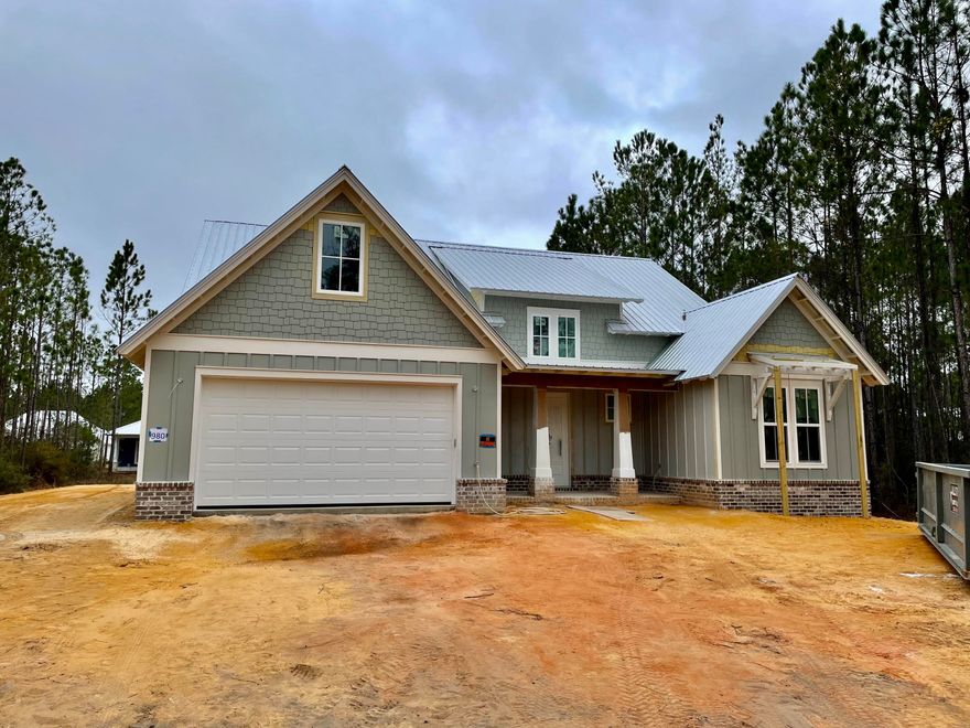 UNDER CONSTRUCTION with an estimated completion of mid-May. This beautiful home built by Grand Bay Construction is nearing completion in the highly sought after, amenity loaded subdivision of Bear Creek. This efficient, open floor plan features vaulted living and master bedroom ceilings, luxury vinyl floors throughout, a recessed fireplace wrapped in shiplap, brushed nickel hardware, pantry barn doors, shaker style cabinets, stainless steel appliances, island with bar seating, a waterfall countertop, and so much more. This home has 4 total bedrooms, 3 full baths with one of the bedrooms on the second floor that will work great for a private home office. The two-car garage also boasts a workshop or space for a home gym. A rear covered patio overlooks a spacious lawn area with...