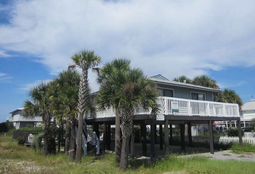 Currently under contingency contract with 72 hour kick-out clause. Showings and back-up offers encouraged. Price recently reduced another $50,000!!!'Grayton Getaway', a classic beach cottage under $1 M located in New Grayton Beach on low traffic Magnolia Street. Only 100 yards to Grayton State Dunes beach access, that leads to approximately 1 mile of state owned beach heading west past beautiful Aligator Lake to Gulf Trace. There is no dispute here over who owns the sand, or the public use of it. Exterior features low maintenance Hardy plank exterior with metal roof. There is a wonderful, in-ground heated pool with a wrap-around deck that provides plenty of area to relax and unwind and entertain family and friends. Enjoy your evenings stargazing or your morning cup of coffee on the front sun deck or rear screened-in porch.Currently generates approximately $45,000 annually in rental income.