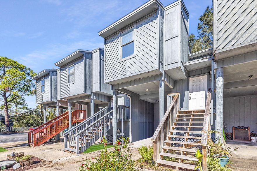 Come enjoy your own slice of paradise in this lovely 2 bedroom, 2 bath town home with views of the bay!  Excellent location close to Eglin AFB, restaurants, and shopping. This home features a spacious living room/dining room combo with sliding glass doors to the balcony. The kitchen has granite countertops, white cabinets, stainless appliances and a pass thru to the dining area. The spacious master bedroom is conveniently located on the lower level and has its own en suite bathroom and sliding glass doors that lead to the private deck. The second bedroom and bathroom are upstairs. This home also has a laundry closet on the first floor. The floors are laminate and tile throughout. There is a resort-style common area that is the perfect place to relax and unwind after a long day. Take a