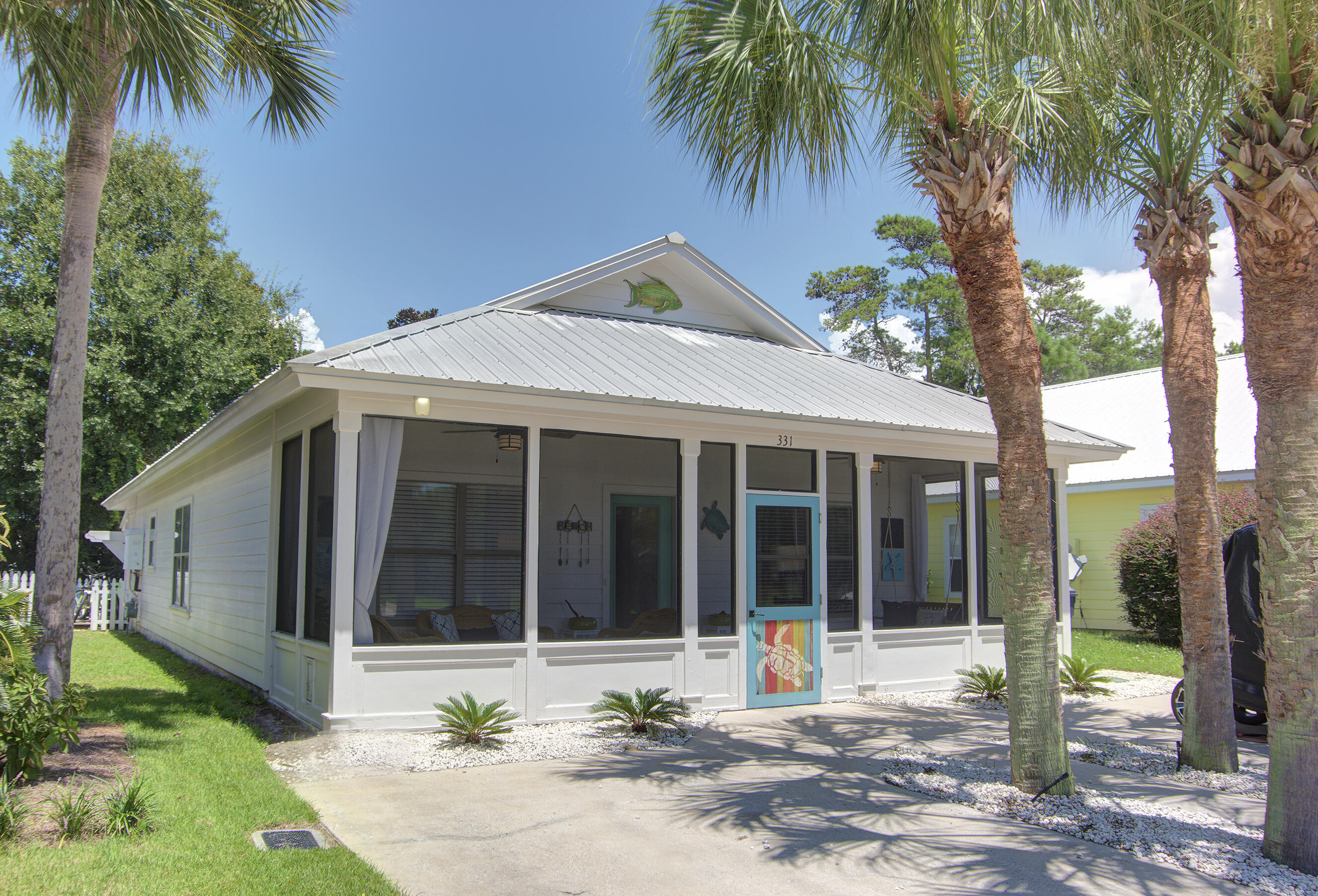 This charming beach cottage in popular Ventana Dunes, offers an incredible value for 30A. It comes fully furnished and has an established rental of 45K gross per year! A short distance from the sparkling gulf waters, this cozy retreat comes fully furnished with welcoming beachy decor. Great layout, full kitchen, sleeps 8-10 comfortably. The community pool is only a few houses away, perfect for a quick dip after a day at the beach. The wide driveway offers plenty of parking. There's additional backyard storage, an extra indoor/outdoor shower off the enclosed back porch. Play corn hole as you wait for dinner on the grill under the enchanting outdoor lights, then enjoy smores over the fire pit. Don't miss out on this chance to own your piece of the 30A lifestyle!