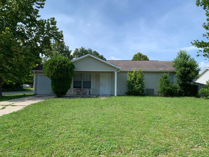 Centrally located 3 bedroom, 2 bath home that is being sold ''As-is'' as seller lives out of the area.  This property is a diamond just waiting to be polished!  There is a covered front porch, corner lot, one car garage and a privacy fenced back yard.  The great room  has vaulted ceilings,  theres a spacious kitchen with plenty of cabinets and a bay window featured in the dining area.  There is a brand new air conditioner.  This would make a great home for first time homebuyers, investors, retired or simply someone that wants to be centrally located.