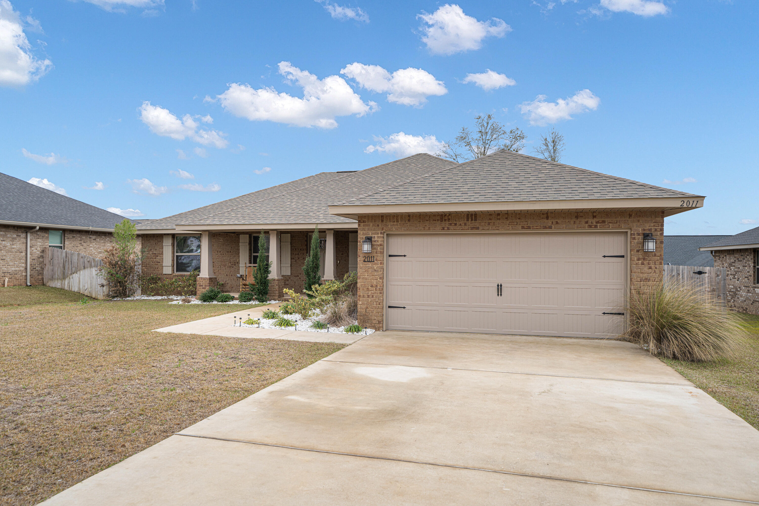 Welcome to this beautiful, like-new home built in 2022 by the highly reputable Adams Homes. This all-brick, 2-bedroom, 2-bathroom home offers quality craftsmanship and modern upgrades throughout. At just 2.5 years old, all the major components--including the roof, HVAC, and water heater--are still like new. The spacious living room features a cathedral ceiling, creating an open and airy feel. The kitchen boasts granite countertops, while the main living areas have durable LVP flooring, with carpet in the bedrooms for added comfort.The garage floor has been epoxy-coated for a sleek, durable finish. Energy-efficient solar panels add extra value, helping to reduce utility costs. The fully fenced backyard offers complete privacy, and the wood deck provides the perfect spot for relaxing