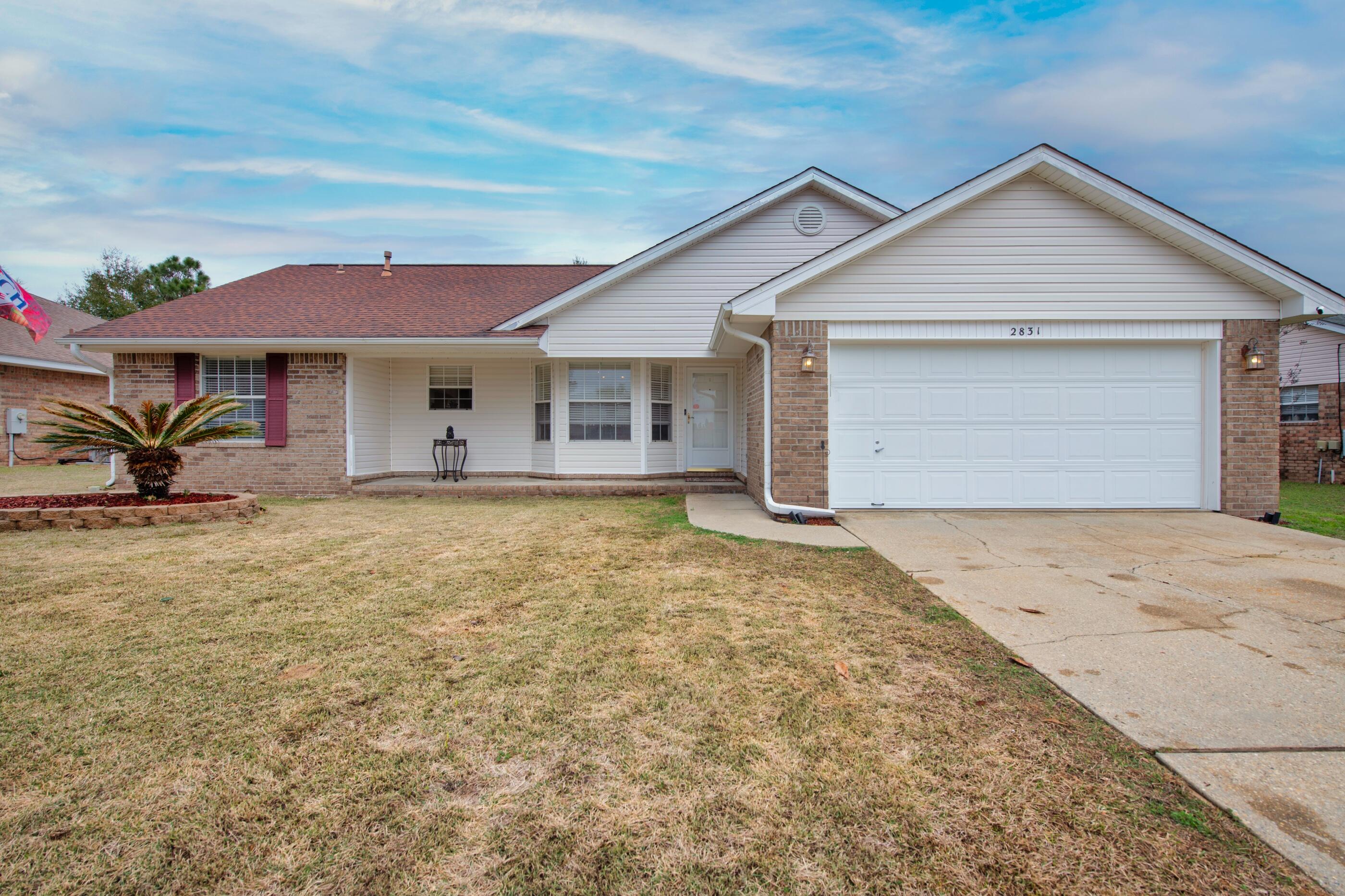 Beautiful 3 bed 2 bathroom home conveniently located in South Crestview on a quiet street. There is a two car garage and a cute front porch! It features a spacious kitchen with stainless steel appliances and an open concept design. The common areas have tile flooring with new carpet in the bedrooms. The backyard is fully fenced in and also includes a big insulated workshop with power!