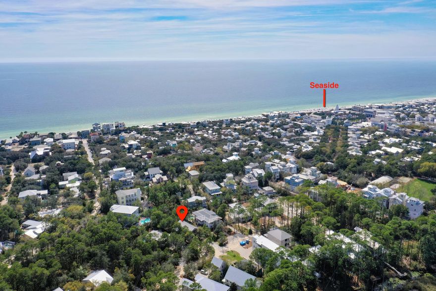 Room to add Pool/Carriage House on Quarter Acre Lot. Incredible opportunity to own a high income-producing property 3 houses from Seaside with multiple nearby beach access points.This 4-bedroom/3-bath home is situated on a beautiful and enormous quarter-acre lot with plenty of room to add a pool, garage, and extra square footage.A trip down Canal Street is like going back in time with it's oak tree canopied streets and quiet surroundings and because it dead-ends directly into Seaside there is no through-traffic.Upon entering you'll notice a wide-open living space with abundant natural light and flows into a kitchen that is fully-appointed with stainless steel appliances and everything needed for a turn-key rental property