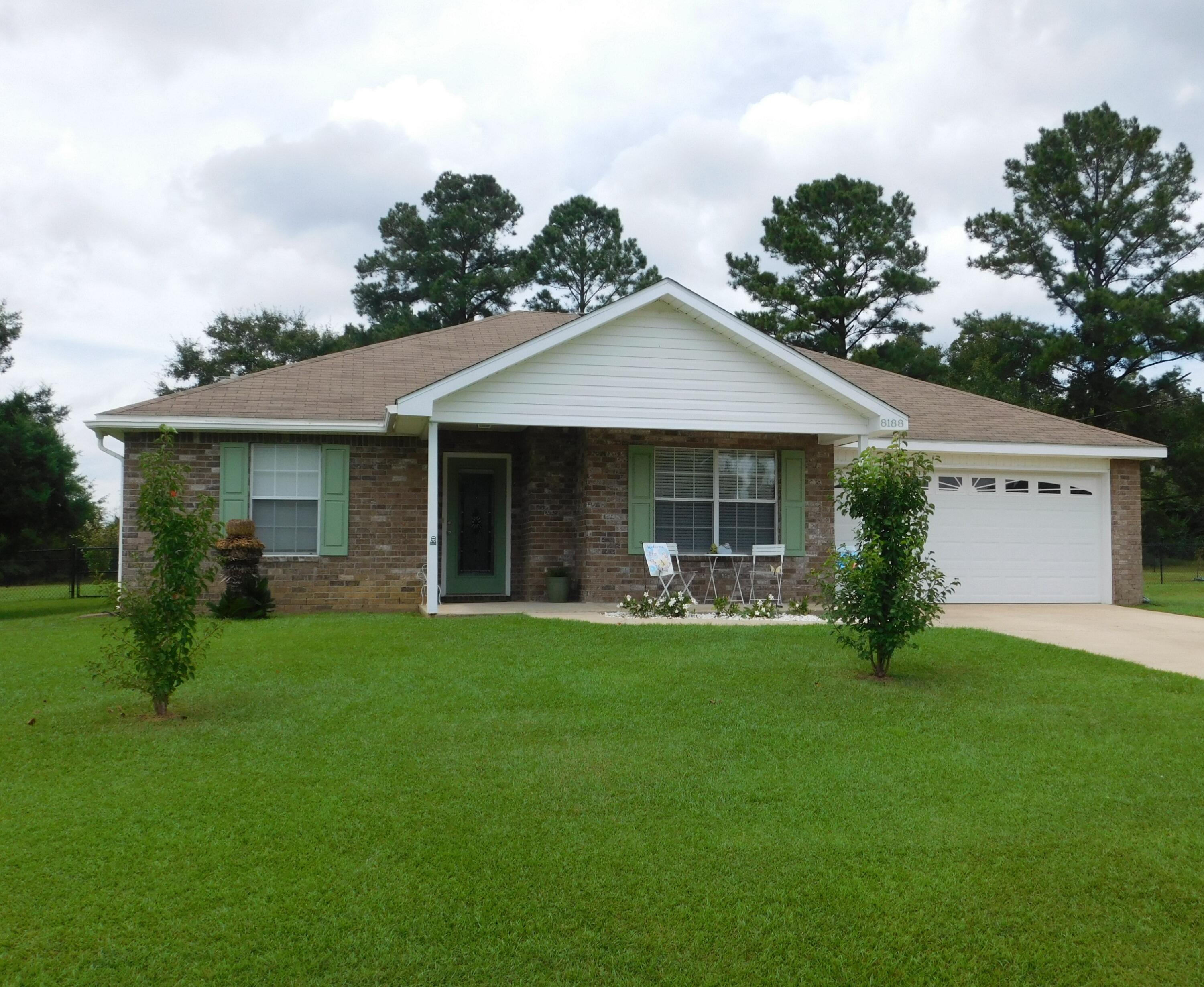 Lovely country setting north of Crestview on .62 of an acre lot. Backyard fenced in to include 8x14 storage shed. Covered patio with wiring for outdoor speakers and ceiling fan. Interior of the home features 3 bedrooms, 2 baths with split bedroom plan. Eat in kitchen with quartz counter tops, island, upgraded stainless steel appliances, plus the coffee bar to remain. Simplisafe alarm system to remain. Open area bar looking out to dining area and family room. Beautiful wood laminate flooring with wiring for surround sound speakers. Barn door opens to hall with 2 additional bedroom freshly painted. Family room freshly painted with french doors that open to 12x20 covered patio. This is a lovely well maintained home inside and out. Don't wait! Make this one yours today.