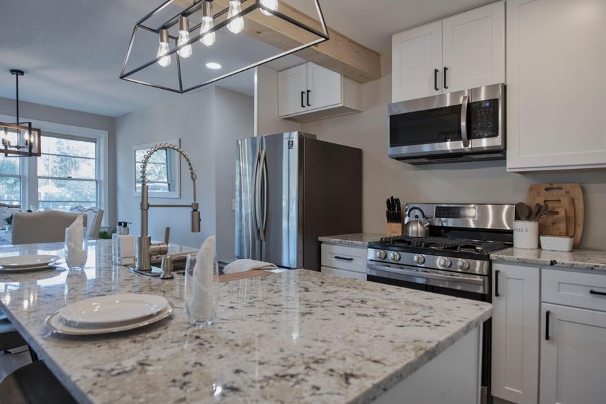 1951 originality meets 2021 brilliance. This charming 1951 home is fully complete, with renovations down to the studs. Features include brand new floors, complete kitchen remodel, lighting fixtures, granite counters, electrical, tankless water heater, landscaping with irrigation, and so much more. Original 71 year old brick is a main feature retained by the designer in the living space. Enjoy a natural gas fireplace, 4 bedrooms, and a large backyard complete with conveying hot tub. Extensive details on this renovation will be made available within days.