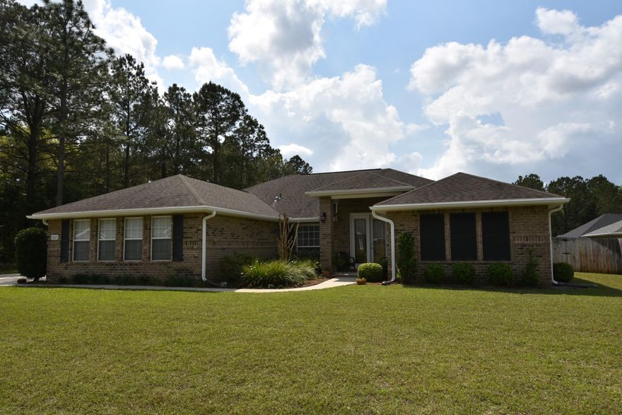 Better than NEW w/oversized ceramic tile and crown molding! BIG Back Yard, Upgraded Kitchen and Walking distance to the SCHOOLS! Offered w/1 YR AHS Home Warranty and Closing Costs Assistance. 4 Bedroom, 3 Bathroom Home is ready for you to Enjoy Inside and Out! Privacy Fenced Back Yard w/a 20'x12' Lanai, workshop, yard building, and a beautiful yard for all your outdoor activities! Entertaining is easy w/2 Living spaces and 2 Dining Areas. Foyer opens up to the Living Room w/access to the Lanai. Formal Dining Room is to the left of the Foyer and has a view into the Kitchen and Family Room! Kitchen features: GRANITE countertops, stacked cabinets, Breakfast Bar and Nook, Pantry, GE appliances and Kenmore Fridge. Access the Lanai from the Kitchen and Family Room. Schedule your viewing!