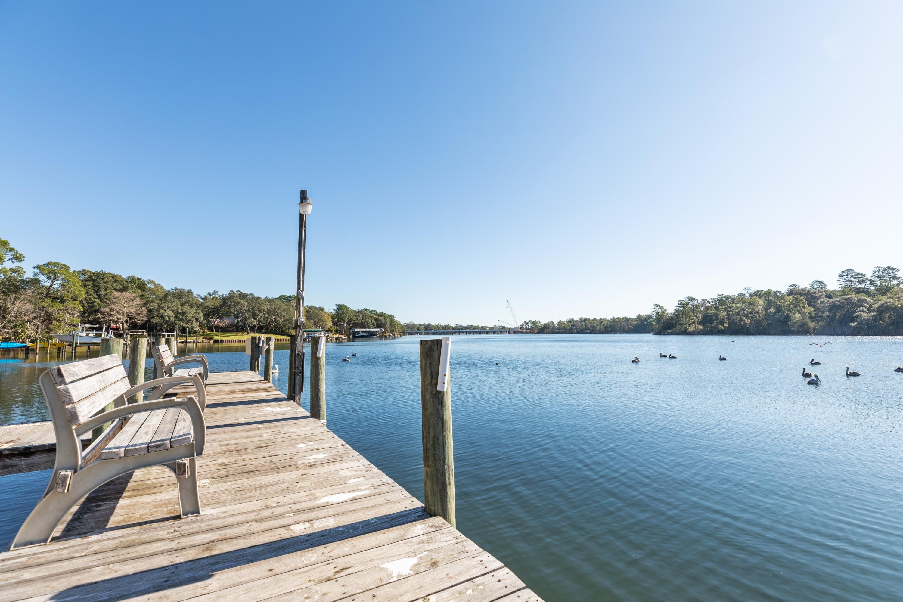 TRANQUILITY on Tom's Bayou! Location perfect for military. Feel the breeze of the Bayou from your own deck in the Hidden Cove community. Only minutes to shopping and A+ schools. Parks are all around this community and the community swimming pool is on the water as well. There is a workout room and community meeting space for your parties. This HIGHLY desired location also provides a quick commute to local military bases like Eglin AFB, Hurlburt and 7th Special Forces on the way to Crestview. This stunning home comes with new flooring, paint, granite countertops, windows and plenty of space with three full bedrooms and three full bathrooms, a Florida room on the water and a library/flex room upstairs looking onto the Bayou. This Florida room will make an amazing paint studio or yoga room.