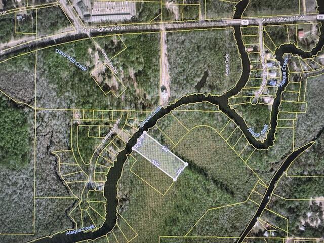 This 2 acre parcel is perfect for a fish camp or weekend getaway.  The parcel is only accessible by boat. Portland Boat Ramp is within very close proximity.  Choctahatchee Bay is also accessible from this property.  Property is located in an AE flood zone.