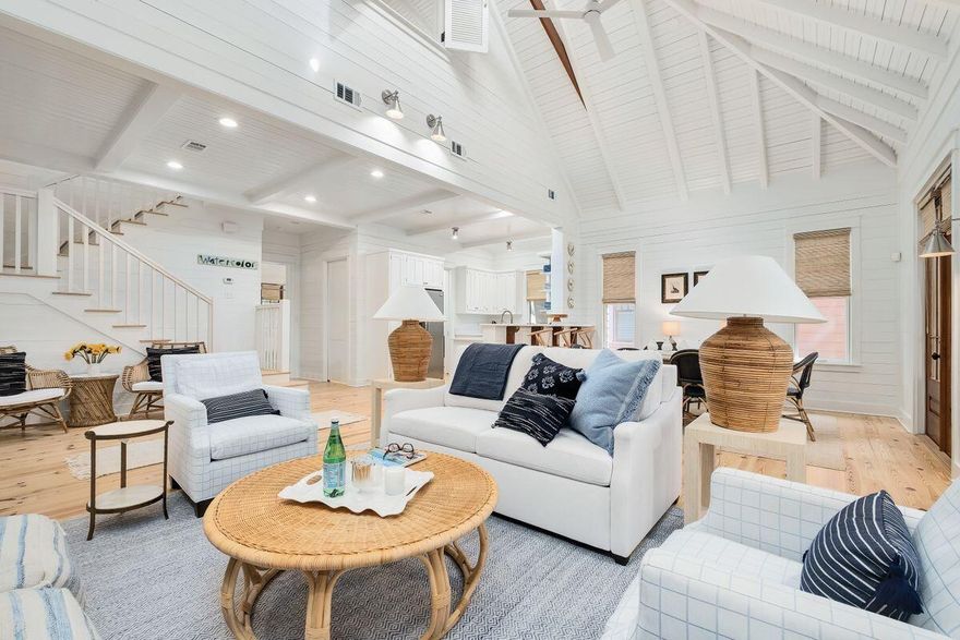 Imagine stepping into a Serena & Lily showroom -- this upscale beach cottage is casual and coastal, relaxed, yet refined. This picture-perfect cottage is ideally located in phase 1 of WaterColor, a short stroll to the LakeHouse pool, WaterColor Beach Club and the Gulf of Mexico. This two-bed, two-and-one-half bath home is the perfect marriage of openness and coziness. Spread over more than 1,700 square feet, this Rose Garden Mews home enjoys views of Crimson Park from the kitchen, living and dining rooms. Cathedral and beamed ceilings complement three sets of French doors and large windows to create an airy and spacious feel. A first-floor owner's suite features an ensuite bath with dual vanities and both a shower, soaking tub and access to a screened rear porch.