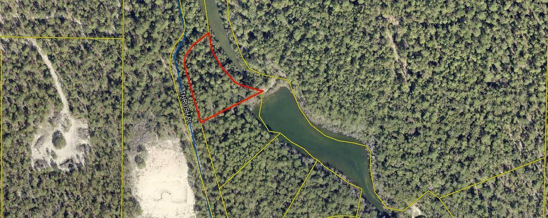 350 feet of waterfront on a beautiful, peaceful lakefront property. There are no motorized vessels/boats/jet skis/etc. allowed on the water. Only people powered vessels like a canoe or row boat. Lot slopes from road down to lake. Build your home or vacation home on this lakefront property. Watch the deer drinking water at the lake.