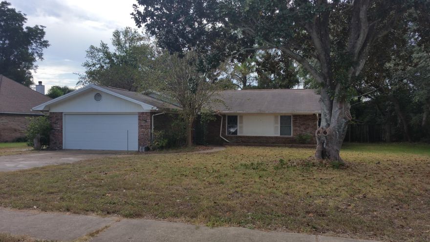 Great location, in the heart of Destin, close to shopping, restaurants, parks, boat launch, harbor, beaches, attractions and in walking distance to Destin Elementary School. Four bedrooms, two baths, fenced backyard with mature oak and magnolia trees,, concrete pad for patio, boat or RV storage. Enclosed Florida room (not reflected in heated and cooled square footage), two car garage. With a some imagination and some TLC, this would make a great primary residence, second home or investment property. Property to be sold ''As-Is'' and will not qualify for VA or FHA financing.