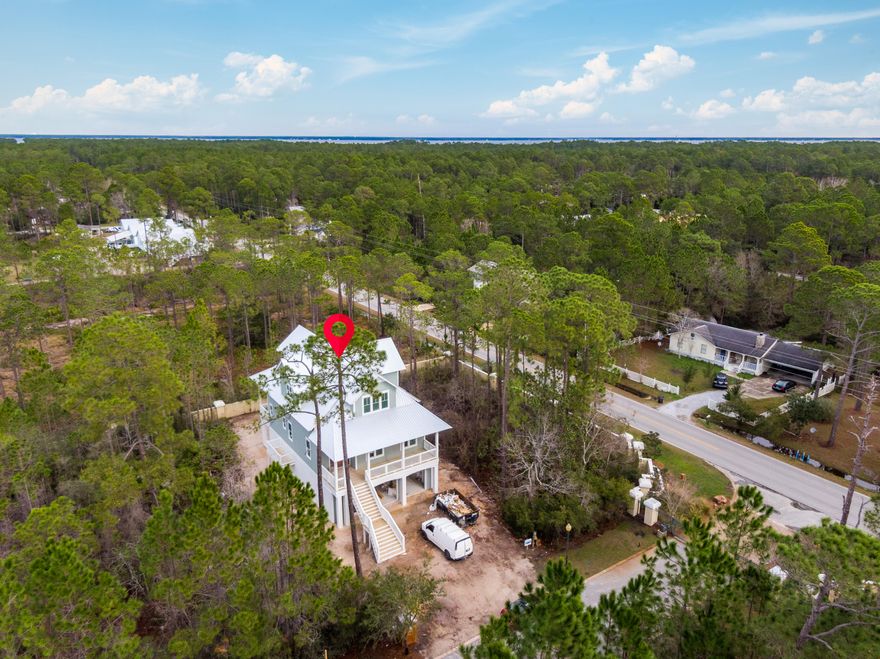 Just reduced !! Custom home in gated waterfront community of Cessna Landing.4 bedroom, 3.5 bathroom custom home features an elevator accessible to all 3 levels. Other highlights include views of the Bay, community access to the bay and community pool. Upgrades galore, this home features 12 ft ceilings on main level and 10 ft ceilings on the top level. Ship lap siding, custom mahogany door, custom cabinets thru out, tiled showers with rimless glass in bathrooms, hardwood floors thru out, fireplace and more.Additionally, this beautiful home features tons of oversized windows, decks, upgraded appliances, parking for 4 cars under in the garage and views of the Bay.This is a must see home that will not last long.