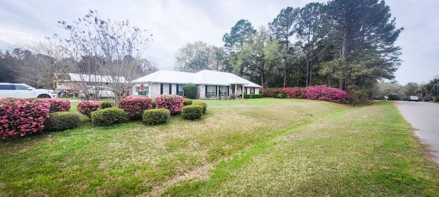 This home has so much to offer  in the quiet Dogwood Estates subdivision~ Brick with metal roof installed June 22,2021~ Remodeled in February 2022 closing in the garage for office and changing out the electrical panel~ 3 bedrooms, 2 full baths, breakfast area and formal dining room~ Laundry room and large office/media room~ The master suite has glass sliding doors opening into a Hobby room as well as a nice storage room~ Off the living room which has a wood burning fireplace for those cold winter days the French doors opens onto a lanai~ The back yard is fenced with a large shop~ Alot of upgrades make this home move in ready~