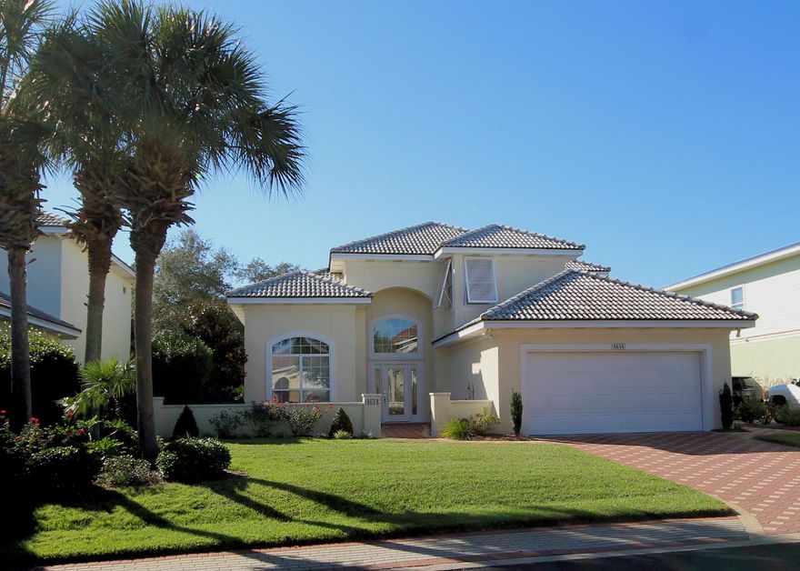 Location...Location...Location...Conveniently located less than 2 blocks from the beach in the premier gated community of Destiny West. Just off Scenic HWY 98 & right between Crystal Beach & Miramar Beach! This custom built home is meticulously maintained and would be perfect for primary residence or a great vacation rental! This mediterranean style home features an impressive court yard entrance, an open floor plan with soaring ceilings, crown molding, recessed lighting, gas fireplace,new tile & carpet throughout & hurricane shutters. The master bedroom is on the 1st floor & boasts of a large master bath,walk in closet, double vanities & under cabinet lighting. There are two additional bedrooms & full bathroom upstairs & a loft with a closet that could easily be turned into a 4th bedroom or an office!  This home also features a private storage room that is heated & cooled off the 2 car garage & currently being utilized as an office.  The covered porch right off the eat-in kitchen, allows for plenty of shade during the hot summer months with the roll down shades. Additionally, there are hurricane shutters for all of the windows throughout the home.  It has a large, well-manicured back yard that extends beyond the grassy area into the natural wooded area which would be plenty of room to build a private pool!  Enjoy the community tennis courts, extra large pool, work out center & the club house.