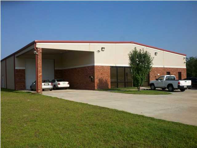 This building can accommodate a variety of uses from offices to manufacturing. Approximately 9,000 sq. ft. of the building is heated and cooled, compressed air lines are located throughout the building, the floor is automobile showroom quality, 16 foot eve height, reception area, private offices, showroom area, over an acre of parking, the south portion of the building is designed so you can drive an 18 wheel truck thru the building and so much more!!!! This building is in like new condition and ready to move into.