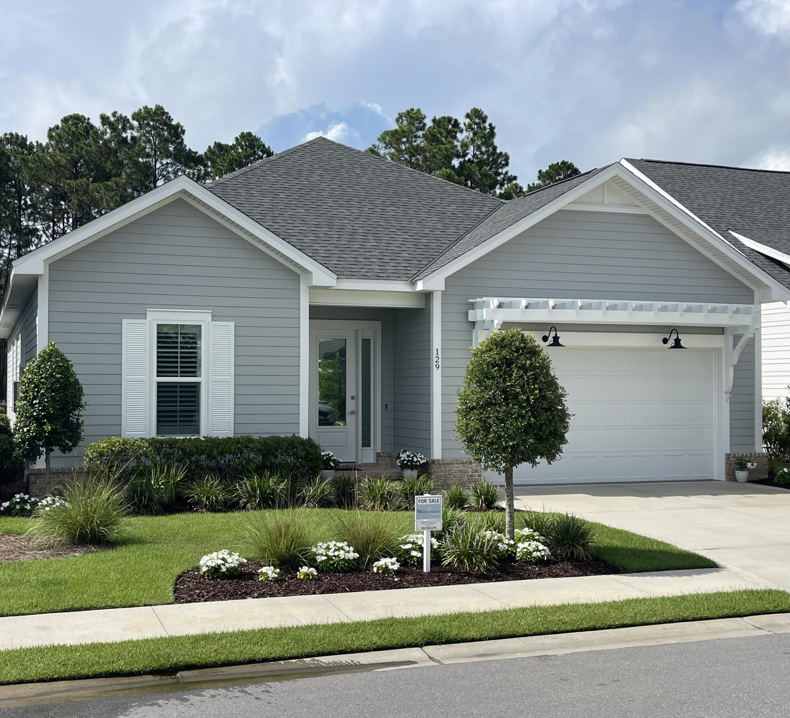 Welcome to the Longleaf Park neighborhood in the heart of the sought-after Watersound Origins community. This stunning, like new, exceptionally well maintained home was completed in 2023 and has over $117,000 in tasteful upgrades, more than any other home on the market in the neighborhood. These are upgrades typically found in much higher end homes and they truly set this one-of-a-kind apart from any other home on the market in the neighborhood. In addition, the purchase of this home includes a one-year home warranty! The upgrades include: Perimeter lot with backyard view of nature preserve, Gas fireplace, Built-in bookcases on either side of fireplace, Custom closets and pantry, Gas package that includes tankless water heater, Upgraded appliances, Stainless steel vent hood with microwave in drawer, Extended kitchen island with cabinets under bar, Upgraded kitchen sink, Laundry room sink, Plantation shutters, Washer/dryer combo, Cabinets in laundry room, Upgraded bathroom mirrors and and towel bars, Upgraded light fixtures, Upgraded landscaping, Under cabinet lighting, Gas stub for gas grill and the Garage floor has been epoxy coated.
This one-of-a-kind masterpiece is a beautifully designed and upgraded Florida residence with the popular 1,960 sq. ft. Brady floor-plan, four bedrooms, two and a half bathrooms and offers a harmonious blend of modern elegance and coastal charm.
Step inside to discover 10-foot ceilings adorned with crown molding, ceiling fans, recessed lighting, plantation shutters and window shades. A beautiful gas fireplace and custom bookcases offer an open-concept layout that seamlessly connects the living, dining, and kitchen areas. The top quality gourmet kitchen features soft-close wood cabinets, an extended spacious island with under counter cabinets, Farmhouse sink, both under and above cabinet lighting, quartz countertops, custom pantry, stylish tiled backsplash, stainless steel appliances and vent hood, KitchenAid wine cooler and a pull out microwave, perfect for both everyday living and entertaining. The laundry room includes a washer/dryer combo and custom laundry sink.
Retreat to the serene primary suite, complete with a spa-like bathroom featuring a double vanity, tiled shower, and large custom walk-in closet. The additional two bedrooms offer ample space and flexibility with a Jack and Jill bath and custom closets. The fourth bedroom, also with a custom closet, offers the option of a dedicated office for the ideal work-from-home setup. Other upgrade features include a tankless water heater and 2-car garage with epoxy coated floor.
Enjoy the Florida lifestyle with an expanded patio and rear privacy fenced backyard, improved landscaping with a picturesque natural view for a peaceful and private outdoor space ideal for relaxing or hosting gatherings. Community amenities include the Village Commons pool, fitness center, sports courts, walking trails, as well as unlimited golf, and generous green spaces enhancing the resort-like atmosphere. The nearby Watersound Town Center provides added convenience with a Publix Super Market and a variety of restaurants and healthcare facilities.
Located just minutes from the pristine beaches of the 30A Emerald Coast, top-rated schools, and a variety of convenient dining and shopping options, this home offers the perfect balance of tranquility and convenience in a premier South Walton neighborhood.
Experience the best of coastal living at 129 Suwannee Drive where comfort meets elegance in a vibrant community setting.