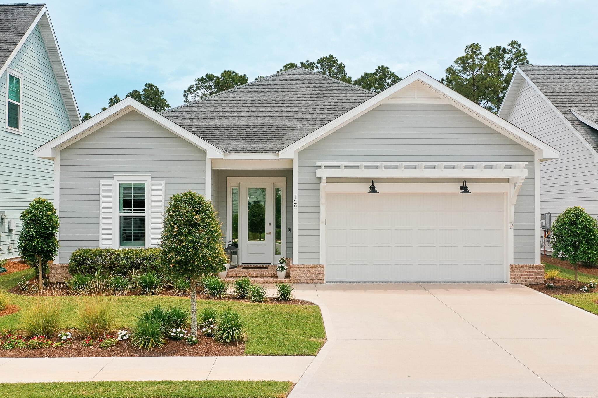 Welcome to the Longleaf Park neighborhood in the heart of the sought-after Watersound Origins community. This stunning, like new, exceptionally well maintained home was completed in 2023 and has $117,445 in tasteful upgrades, more than any other home in the neighborhood. This one-of-a-kind masterpiece is a beautifully designed and upgraded Florida residence with the popular 1,960 sq. ft. Brady floor-plan, four bedrooms, two and a half bathrooms and offers a harmonious blend of modern elegance and coastal charm. Step inside to discover 10-foot ceilings adorned with crown molding, ceiling fans, recessed lighting, plantation shutters and window shades. A beautiful gas fireplace and custom bookcases offer an open-concept layout that seamlessly connects the living, dining, and kitchen areas. The top quality gourmet kitchen features soft-close wood cabinets, an extended spacious island with under counter cabinets, Farmhouse sink, both under and above cabinet lighting, quartz countertops, custom pantry, stylish tiled backsplash, stainless steel appliances and vent hood, KitchenAid wine cooler and a pull out microwave, perfect for both everyday living and entertaining. The laundry room includes a washer/dryer combo and custom laundry sink.
Retreat to the serene primary suite, complete with a spa-like bathroom featuring a double vanity, tiled shower, and large custom walk-in closet. The additional two bedrooms offer ample space and flexibility with a Jack and Jill bath and custom closets. The fourth bedroom, also with a custom closet, offers the option of a dedicated office for the ideal work-from-home setup. Other upgrade features include a tankless water heater and 2-car garage with epoxy coated floor.
Enjoy the Florida lifestyle with an expanded patio and rear privacy fenced backyard, improved landscaping with a picturesque natural view for a peaceful and private outdoor space ideal for relaxing or hosting gatherings. Community amenities include the Village Commons pool, fitness center, sports courts, walking trails, as well as unlimited golf, and generous green spaces enhancing the resort-like atmosphere. The nearby Watersound Town Center provides added convenience with a Publix Super Market and a variety of restaurants and healthcare facilities.
Located just minutes from the pristine beaches of the 30A Emerald Coast, top-rated schools, and a variety of convenient dining and shopping options, this home offers the perfect balance of tranquility and convenience in a premier South Walton neighborhood.
Experience the best of coastal living at 129 Suwannee Drive where comfort meets elegance in a vibrant community setting.