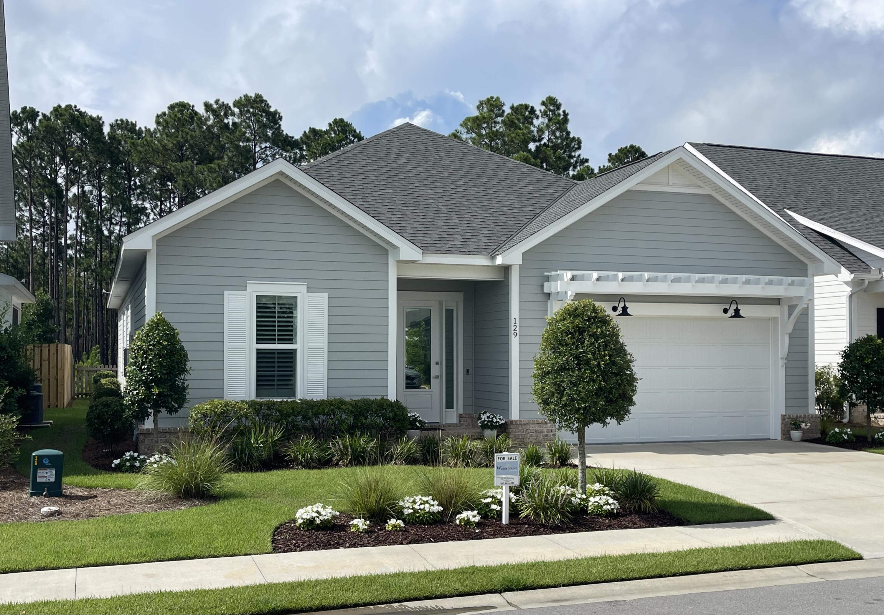 Welcome to the Longleaf Park neighborhood in the heart of the sought-after Watersound Origins community. This stunning, like new, exceptionally well maintained home was completed in 2023 and has over $117,000 in tasteful upgrades, more than any other home on the market in the neighborhood. These are upgrades typically found in much higher end homes and they truly set this one-of-a-kind apart from any other home on the market in the neighborhood. These upgrades include: Perimeter lot with backyard view of nature preserve, Gas fireplace, Built-in bookcases on either side of fireplace, Custom closets and pantry, Gas package that includes tankless water heater, Upgraded appliances, Stainless steel vent hood with microwave in drawer, Extended kitchen island with cabinets under bar, Upgraded kitchen sink, Laundry room sink, Plantation shutters, Washer/dryer combo, Cabinets in laundry room, Upgraded bathroom mirrors and and towel bars, Upgraded light fixtures, Upgraded landscaping, Under cabinet lighting, Gas stub for gas grill and the Garage floor has been epoxy coated.
This one-of-a-kind masterpiece is a beautifully designed and upgraded Florida residence with the popular 1,960 sq. ft. Brady floor-plan, four bedrooms, two and a half bathrooms and offers a harmonious blend of modern elegance and coastal charm.
Step inside to discover 10-foot ceilings adorned with crown molding, ceiling fans, recessed lighting, plantation shutters and window shades. A beautiful gas fireplace and custom bookcases offer an open-concept layout that seamlessly connects the living, dining, and kitchen areas. The top quality gourmet kitchen features soft-close wood cabinets, an extended spacious island with under counter cabinets, Farmhouse sink, both under and above cabinet lighting, quartz countertops, custom pantry, stylish tiled backsplash, stainless steel appliances and vent hood, KitchenAid wine cooler and a pull out microwave, perfect for both everyday living and entertaining. The laundry room includes a washer/dryer combo and custom laundry sink.
Retreat to the serene primary suite, complete with a spa-like bathroom featuring a double vanity, tiled shower, and large custom walk-in closet. The additional two bedrooms offer ample space and flexibility with a Jack and Jill bath and custom closets. The fourth bedroom, also with a custom closet, offers the option of a dedicated office for the ideal work-from-home setup. Other upgrade features include a tankless water heater and 2-car garage with epoxy coated floor.
Enjoy the Florida lifestyle with an expanded patio and rear privacy fenced backyard, improved landscaping with a picturesque natural view for a peaceful and private outdoor space ideal for relaxing or hosting gatherings. Community amenities include the Village Commons pool, fitness center, sports courts, walking trails, as well as unlimited golf, and generous green spaces enhancing the resort-like atmosphere. The nearby Watersound Town Center provides added convenience with a Publix Super Market and a variety of restaurants and healthcare facilities.
Located just minutes from the pristine beaches of the 30A Emerald Coast, top-rated schools, and a variety of convenient dining and shopping options, this home offers the perfect balance of tranquility and convenience in a premier South Walton neighborhood.
Experience the best of coastal living at 129 Suwannee Drive where comfort meets elegance in a vibrant community setting.
