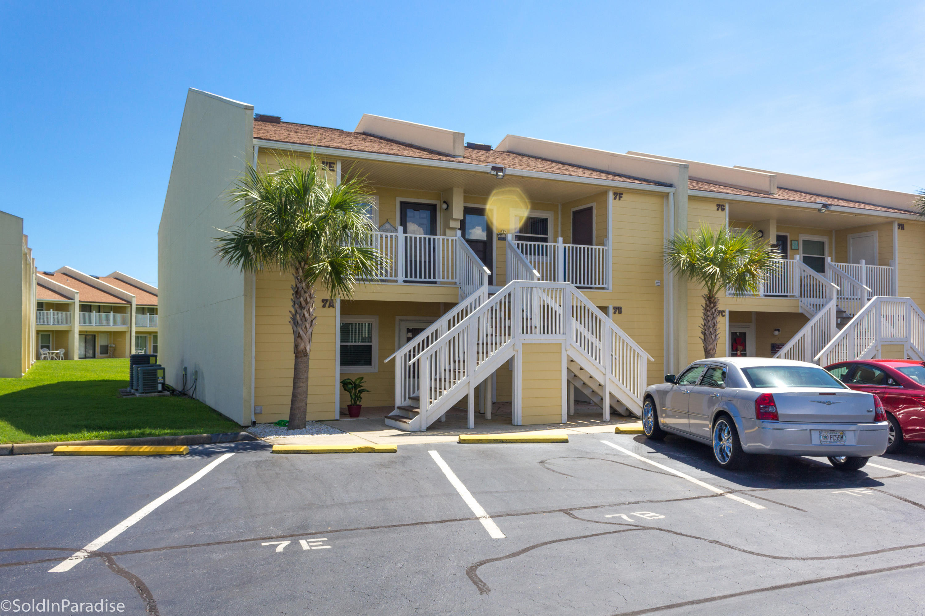 Tucked away within the quiet gated community of Seacove you'll discover this desirable 2 bedroom 2 bath unit. Currently used as a vacation home, this second story end unit has been well cared for. The master bedroom, bath, kitchen, and living area are all on the main level. On the second level you'll find a loft bedroom and full bath. Relax on the spacious balcony while overlooking the well-manicured courtyard and inviting pool. The separate laundry closet is off the front patio. Seacove amenities include a renovated pool area which offers splash fountains and zero-entry access, charcoal grills, and private deeded beach access just a few steps away. This is a perfect getaway beach home or investment property. Paradise! Rental projection: $18k+! Buyer to verify dimensions and fees.