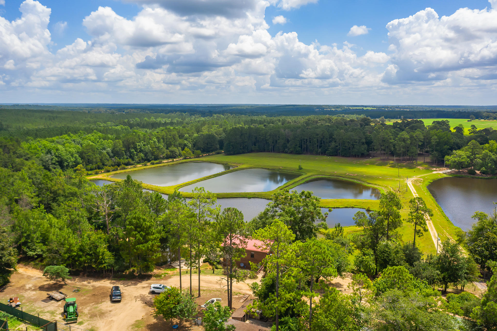 The Santa Rosa Ranch is a unique opportunity operating both as an income generating breeding facility and family attraction. The Ranch consists of just over 545 acres. It is a combination of pastures, agricultural fields, forests and 13 total ponds. The ponds are stocked with Largemouth Bass, Bream and Catfish. There is a caretaker's cabin overlooking several ponds included in the purchase. This is an excellent opportunity to purchase substantial acreage just north of the I-10 corridor. The Ranch could continue as a family attraction bringing in people for hayrides, petting zoos, fishing, picking pumpkins or other crops or hosting gatherings. The grazing and breeding areas are not impacted by the attraction areas allowing both aspects of the ranch to operate simultaneously.