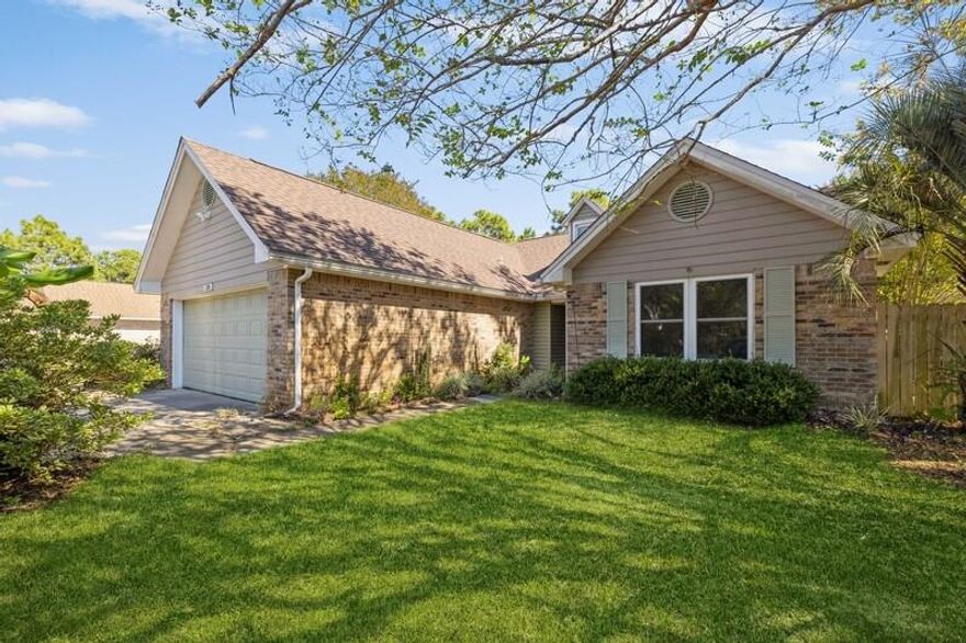 PRICE REDUCTION!!! $10K Buyer Incentive!!! This beautiful 3 bedroom 2 full bath has all the charm you could ask for. Nestled in a quiet neighborhood with great privacy. Minutes from Navarre Beach the home boasts an open concept floor plan, with hand crafted tile back splash and ship lap in the kitchen. High cathedral ceilings add to the openness of the living room. The living room also features a wood burning fireplace, perfect to cozying up a cold winter evening. The Florida room features its own air conditioner, allowing you to enjoy the beauty of the outdoors, while remaining cool and comfortable. In addition to the living room, the master bedroom also features cathedral ceilings. New Roof in 2020.  This turn key home is Ready for a new owner