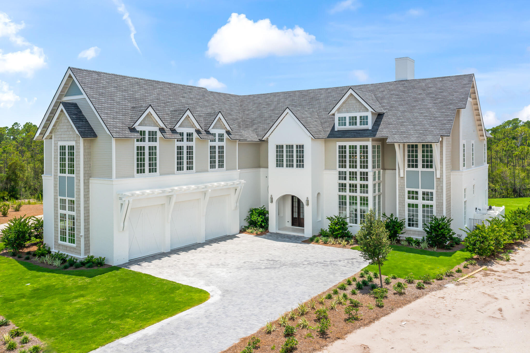 Indulge in lavish lifestyle at its finest with this stunningly crafted custom-built home situated in one of the most coveted and flourishing communities along 30A- Camp Creek Watersound. With construction commencing in 2023, this opulent abode is meticulously constructed using premium materials and boasts exceptional finishes and fixtures. The house is accessorized with an abundance of windows, which coupled with custom lighting, creates a cozy and warm atmosphere. Delightful and inviting porches adorn each level, which exudes a charming and welcoming ambiance for relaxation and socializing, while offering breathtaking scenic views.*Home will be complete by the end of April