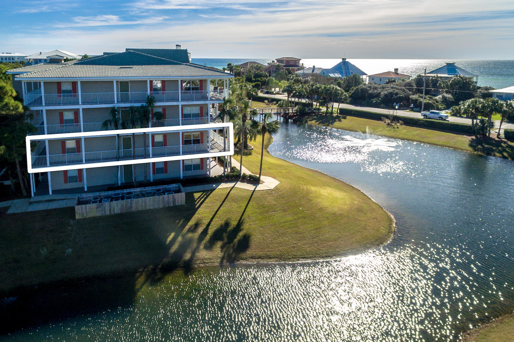 Cozy, comfortable, convenient and contemporary are the hallmarks of this two-bedroom, two-bath condo. The low density, four-story building is ideally located across the street from the sugar white sandy beach and emerald green waters of the Gulf of Mexico. An updated kitchen features granite countertops, cottage style cabinets, wood shelved pantry, classy stainless steel appliances and cool pendant drop lights over the breakfast bar. The living room and dining area open via French-style doors to the wraparound porch, found only on 6 units in the building. The western end location assures a heightened sense of privacy, expanded views, and more natural light inside the condo. Two bedrooms, two bathrooms, double bunk space, and full-sized washer and dryer provide comfort for homeowners,