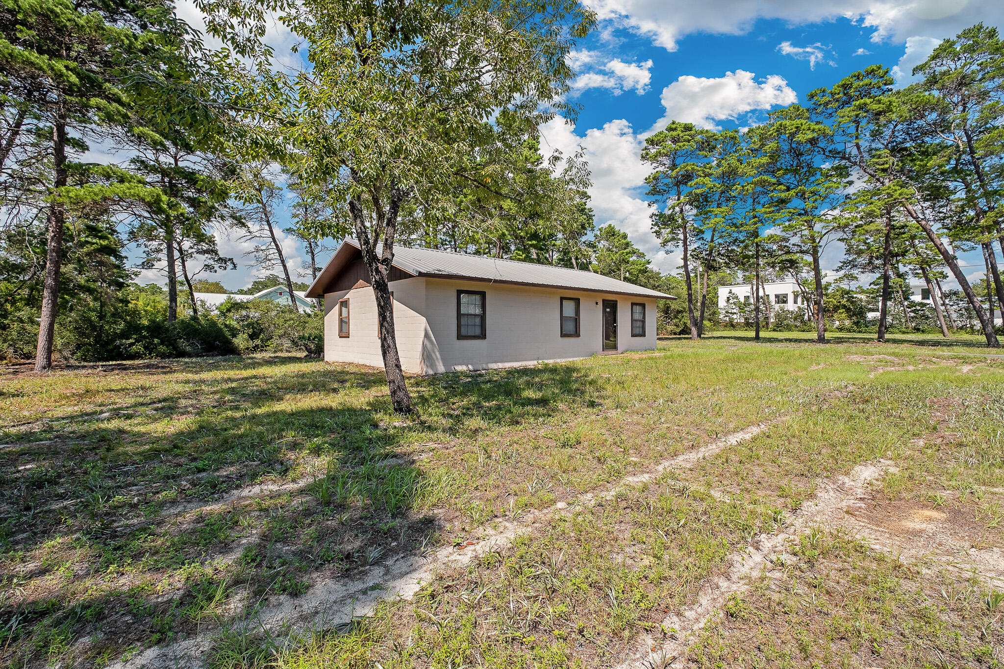 Discover a rare opportunity to own a large corner lot in sought-after Inlet Beach. This .40 acre property sits in a prime location with no HOA and close to Inlet Beach Orange Street beach access and just steps to 30avenue and 30A for all of the shopping & dining you could ever want. An old Florida style cinderblock home currently exits on the property. Easy remodel to rent or just enjoy while you design your forever home. **Please note renderings are for illustration only and do not represent size of home to exact scale**
