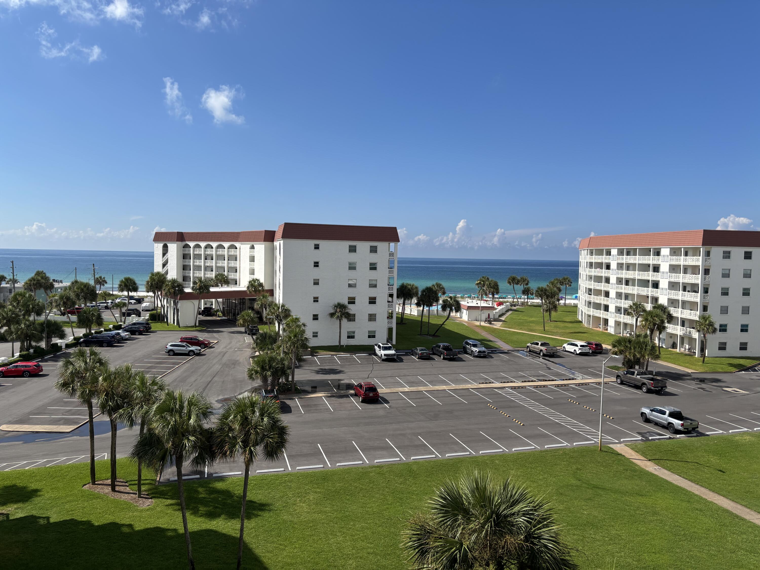 Perched on the top floor this lovely condo has a great view of the Gulf of Mexico. The remodeled kitchen opens up the floor plan and gives the condo an airy and inviting feel. Tile and glass shower along with an updated vanity in the bathroom. All the popcorn was removed from the ceiling. You can make family memories and cash in $$$ on vacation rentals. With the sleeper sofa you can accommodate 4 people. Direct access to the balcony from the bedroom and living room. Located on 12 acres there is lots of green space and some of the least crowded beaches around. 2 pools, hot tub, sauna, tennis, pickle ball, basketball, and community grills are some of the fun amenities. Lots of exciting restaurants and attractions in the area.
