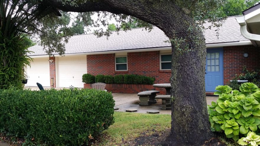 2 houses in 1 and priced to sell! If you have been searching for space, inside and out, you've found it! This home has over 2000 sf indoor living space with the attached Mother-in-law/guest house which has it's own separate kitchen, electric and air-conditioning. Beautiful large lot and three garages in desirable established neighborhood. There's plenty of room to park your boat or store other outdoor toys. Imagine you're own workshop! The back yard offers a serene environment and is large enough to add a pool and separate play area for young children. Upgrades include: new windows installed this year throughout home, with warranty transfer option, bathroom vanities and hardwood floors. This home has been perfectly maintained.