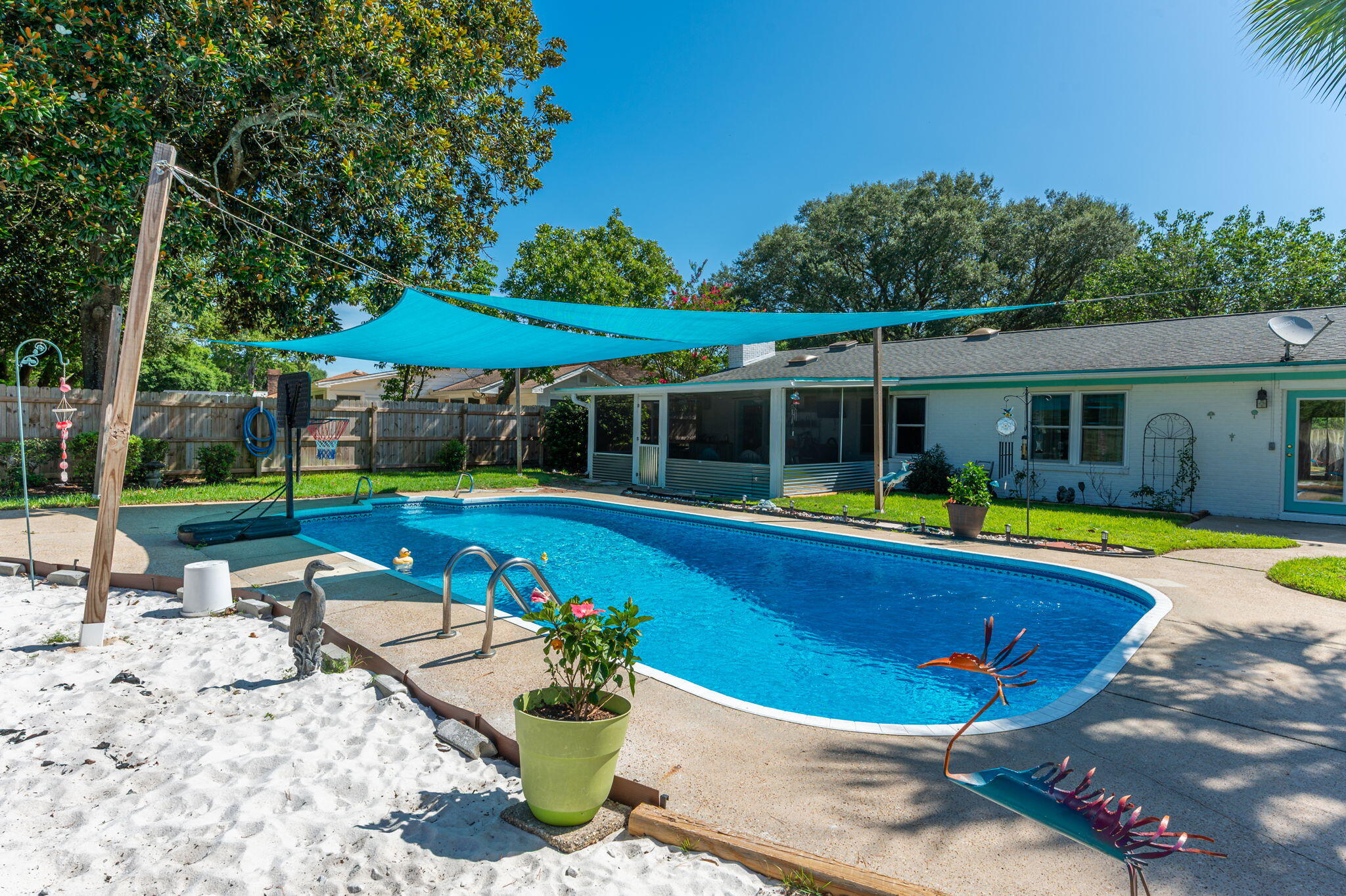 Welcome to Lake Lorraine Estates--just 5 minutes from Eglin Air Force Base, 15 minutes to Hurlburt Field and the stunning white-sand beaches of the Emerald Coast! This beautiful home offers the perfect blend of comfort and convenience.The family rooms cozy gas fireplace is convenient to the updated kitchen with granite countertops. Tile and LVP flooring throughout the main living areas. The screened patio leads to a sparkling in-ground pool surrounded by lush tropical landscaping-- is like having your own private beach oasis.You will also find a spacious primary suite with a fully renovated bathroom and French doors that open directly to your private backyard retreat. The split floor plan features two additional bedrooms and an updated full bath on the opposite side of the home, along with the laundry room that includes a versatile flex space, home office or craft room.
Outdoors, the side yard boasts a 20' x 11' workshop with electricity and AC. Expanded driveway is perfect for your RV (+hookup) or boat. The privacy-fenced backyard is ideal for entertaining, relaxing by the pool, or weekend cookouts. No HOA. A rare find in a prime location!
Roof: 2011 HVAC: 2019 WH: 2019/Gas