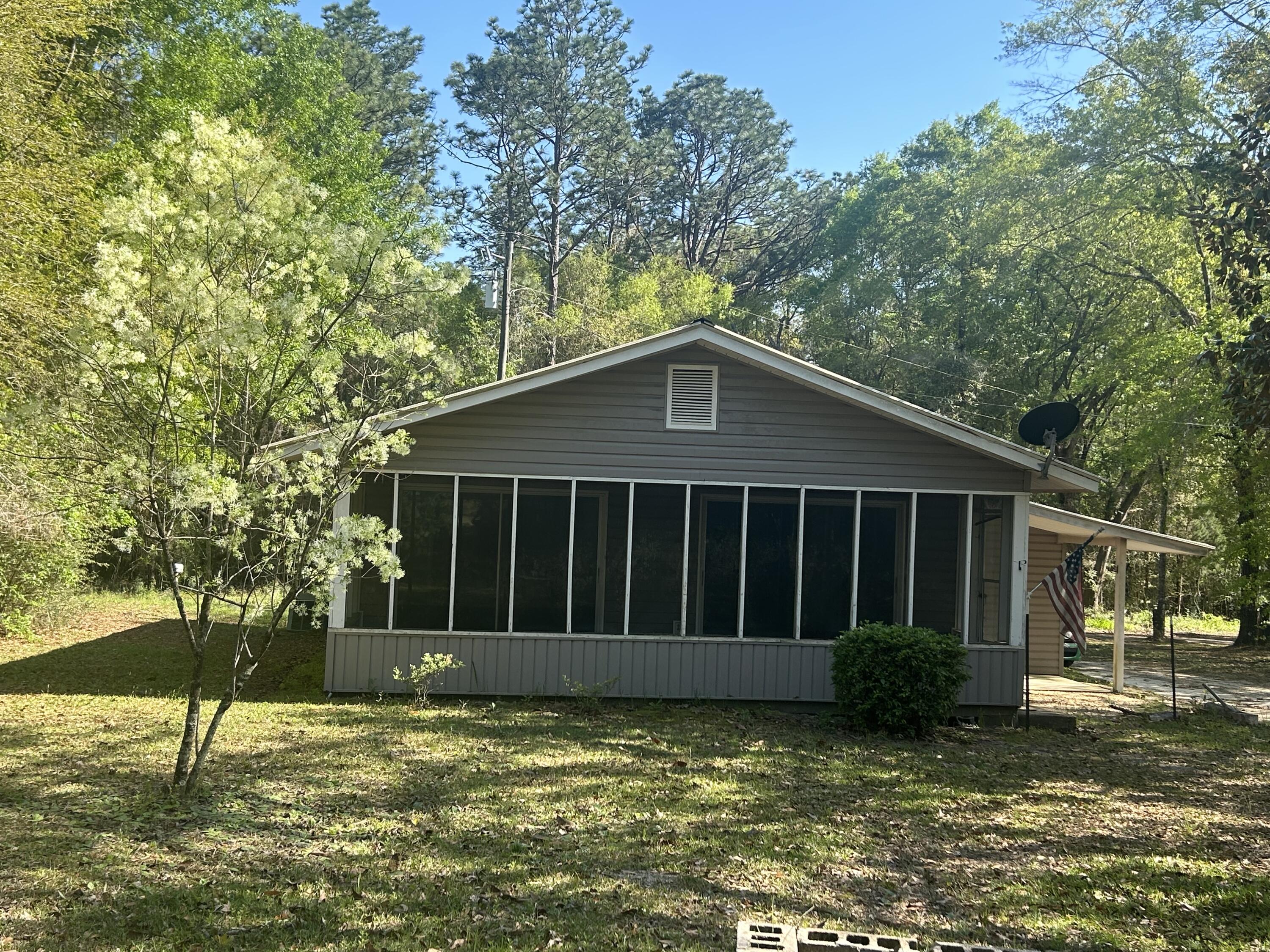 Currently under renovations Available May 12, 2025, this charming 2-bedroom, 1-bathroom home is nestled in the peaceful Dogwood Lakes community of Bonifay, Florida. Built in 1973, the home offers 864 square feet of cozy living space and sits on a spacious 0.43-acre lot. Inside, you'll find comfortable bedrooms, a functional layout, and durable flooring. The home is surrounded by natural beauty and offers access to a scenic golf course and public lakes--ideal for fishing, kayaking, or relaxing by the water. With a metal roof, wood siding, and a serene setting, this property is perfect for anyone looking for quiet country living with the benefits of a community.