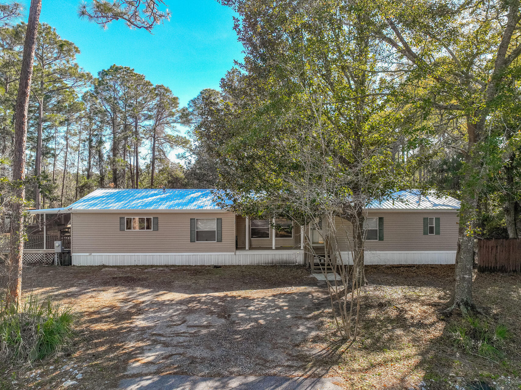 NEW ROOF!! $34k PRICE REDUCTION!! Highly desirable Mussett Bayou area! Perfectly located to all that Santa Rosa Beach has to offer! Shopping, Dining, 30A, Beaches, Sandestin, Sacred Heart Hospital and the best schools in the area are just a few of the highlights that need mention. This well maintained three bedroom home features TWO master suites and THREE full bathrooms! With over 2200 sqft of living space your family large or small will have plenty of room to spread out and relax. Situated on a large 1/2 acre lot the outdoor space will be sure to please with a covered screened in porch, large deck, and spacious backyard. Loral Road is a quiet dead end street with no through traffic and would make a great primary home, second home or investment property! Call today for more information!