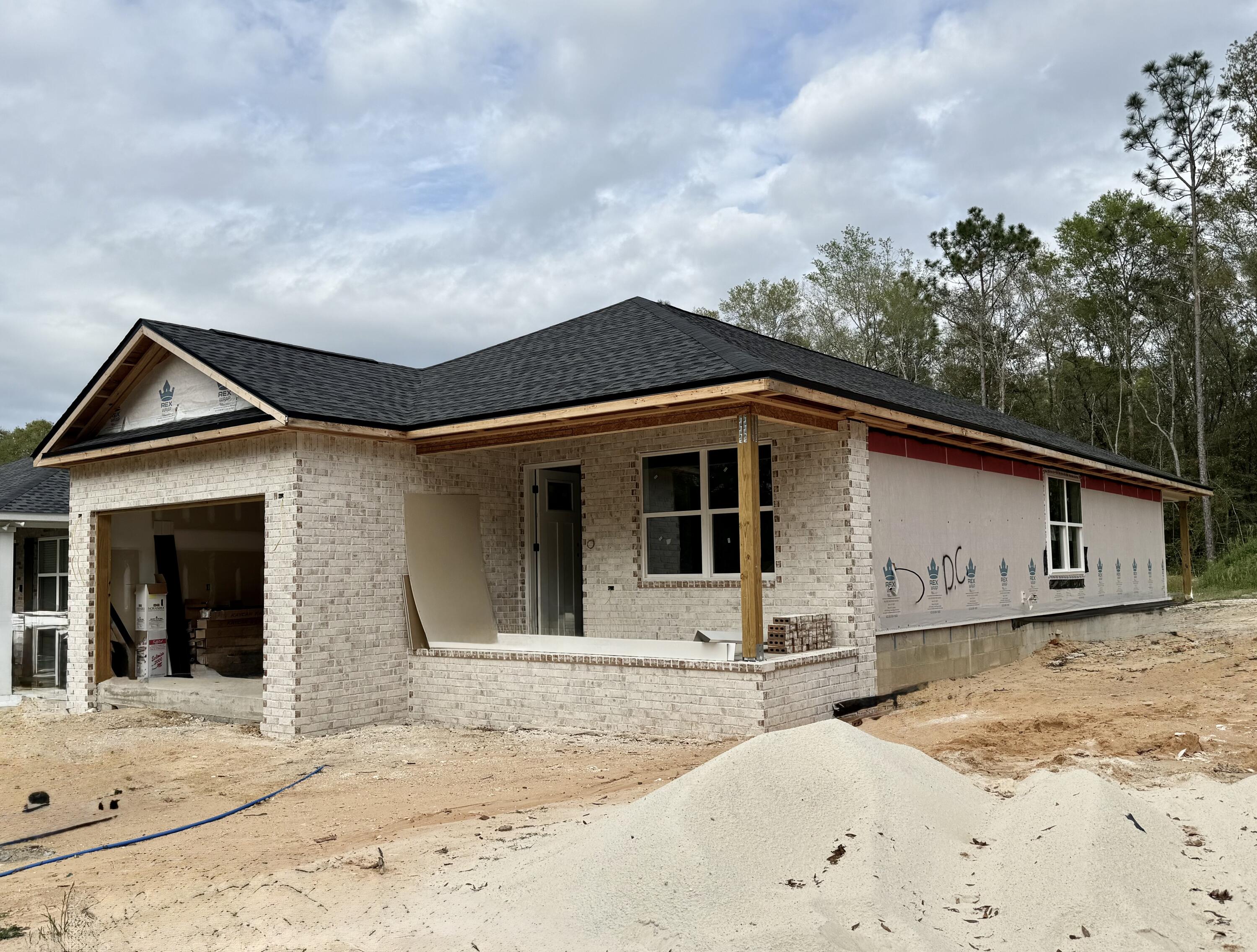 ***BUILDER INCENTIVES *** COMPLETE WITH BLINDS AND A REFRIGERATOR IN ADDITION TO SELLER'S CONTRIBUTION OF UP TO $10K TOWARDS BUYER'S CLOSING COSTS!! Unlock the door to your future as you discover the difference in exceptional quality w/ this newly constructed home in South Crestview. Built by Parade of Homes Award Winning Builder and convenient to military bases and I-10, this 3 bd/2 ba new build is located on nearly 3/4 of an acre. Exterior of the home boasts both a front covered porch and rear covered porch. Inside you will find LVP flooring throughout and an open floor plan. Kitchen boasts beautiful white cabinetry, stainless steel appliances and quartz countertops. Master suite has dual vanity, walk-in closet and shower. Nice sized guest rooms! Est date of completion is MID MAY!