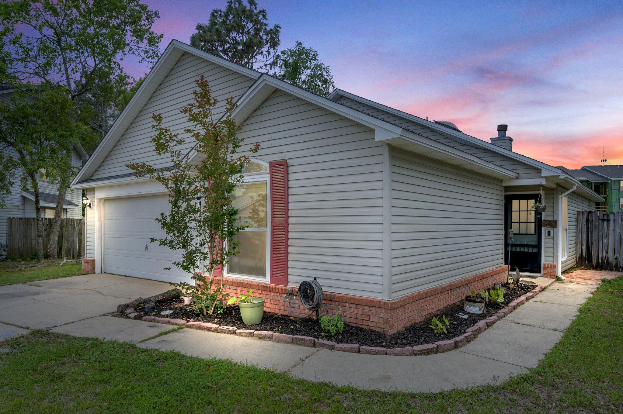 Welcome home to 21 Dabney Ct! This home features a roof that is only ONE YEAR OLD, double pane windows with a lifetime warranty, and a newer HVAC system!! Walking in you are greeted with laminate flooring that can be found throughout the home with tile in the wet areas. This OPEN FLOOR PLAN has a kitchen that overlooks your living room and dining area. There is an enclosed heated/cooled Florida room right beyond the dining with access to the backyard, as well! This home features a split floor plan with the primary bedroom located past the kitchen and the two additional rooms on the other side of the home offering a little extra privacy for the owners of the home. Take a step out back and you'll find a charming seating area with a brick path to the large side yard! Don't miss out!