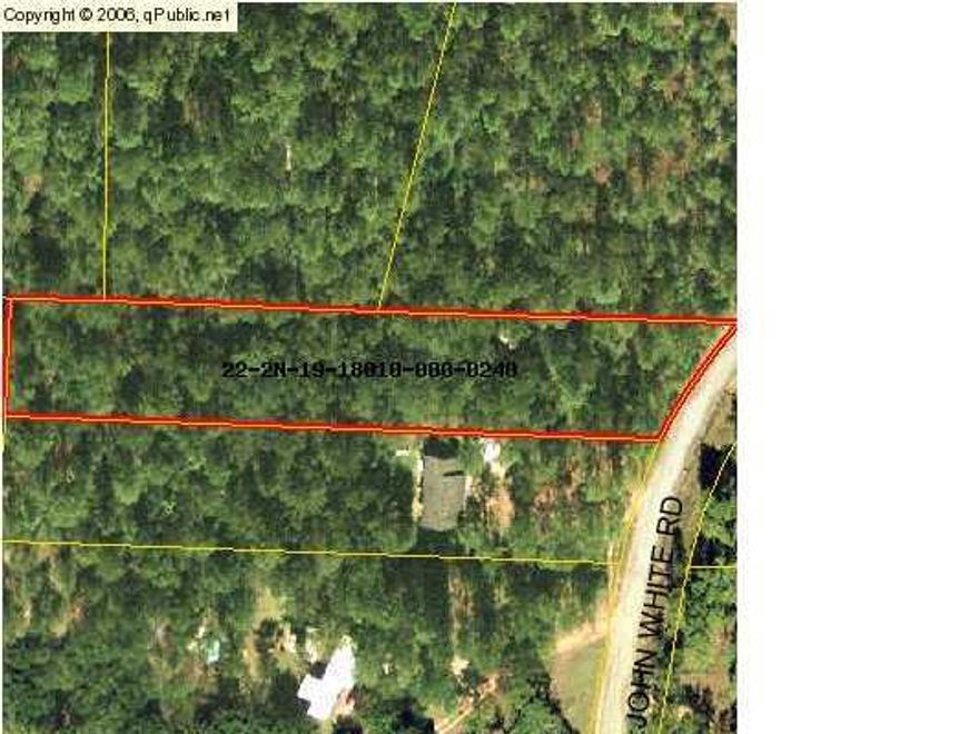 This is a great property totaling just over 1 acre close to town. The property is level and adjacent to the paved road. The wooded parcel has a 2 story shed/out building already in place. Build you new home here. Seller is motivated and will look at offers.