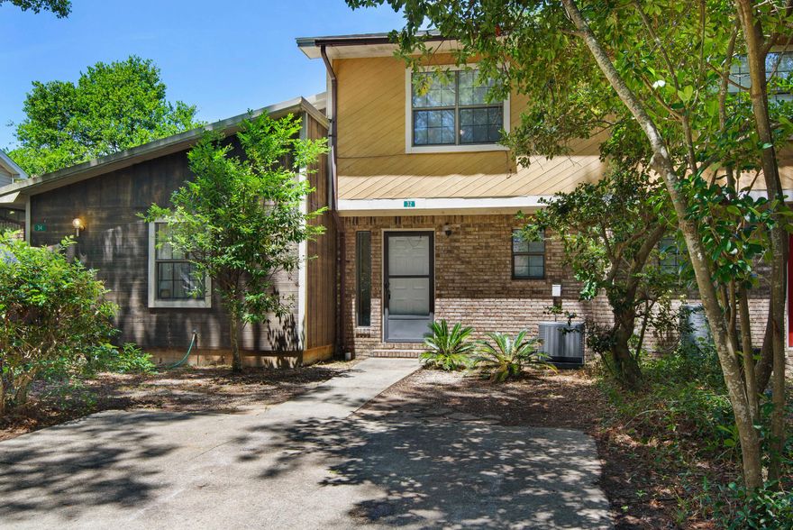 Two bedroom, two-story townhouse located minutes from downtown Fort Walton Beach. The convenience of a half bath downstairs adds to the comfort of this unit. Back yard is fenced and patio is screened in. Plenty of room to enjoy the outdoors.  Interior Downstairs is fully tiled.  Master bedroom offers a walk in closet and private balcony that overlooks the back yard. New carpet upstairs. New roof.  New hot water heater.