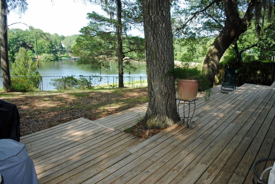 $2,500 Carpet Allowance...Lakefront home with 105 ft. on Lake Sharon. Sit on your porch and enjoy the views and wildlife. Over one acre, this country ranch style 3BR / 2BA home has a beautiful custom kitchen with solid maple cabinets and granite countertops. The living room features a stone fireplace with wood-burning stove and sliding doors to large, multi-level deck. There is a formal dining room plus a breakfast room with sliding doors to the deck. The master suite has double closets and the master bath has a walk-in shower, double vanity, and large linen closet. There are two generous size guest bedrooms and a full bath with tile surround. Other features include all appliances, a 2-car garage, huge multi-level deck, fenced back yard, hurricane shutters,3 outside storage units
