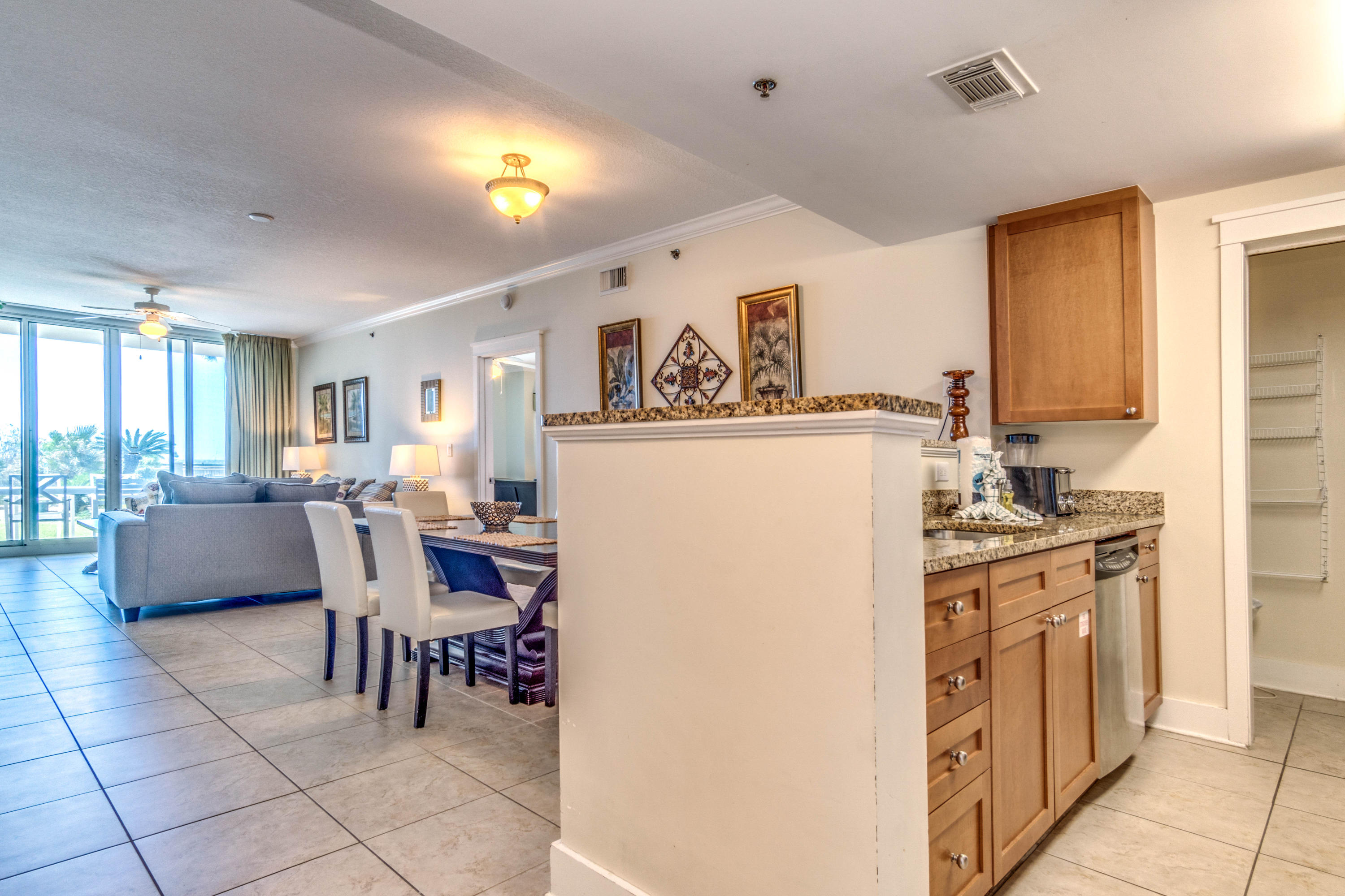 Welcome to Waterscape, arguably one of the best vacation rental communities along the Emerald Coast! This beautiful 2 bedroom 2.5 bath with hallway bunks is located on the desirable first floor and is sure to impress. It's just steps away from the community amenities and beach access. It also offers a private getaway on the quite side of the building. Renters love this unit due to the location, and what seems to be their own private lawn, located directly off the balcony, which allows the kids to spread out and play after they've grown tired of floating around the lazy river or boogie boarding at the beach. This community has it all and keeps people keep coming back, year after year! Inventory is currently at an all time low. Call now before this one is gone!