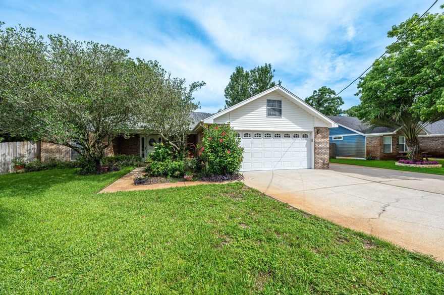 Located in the heart of Destin, this home offers a wonderful climate-controlled sunroom encompassed with windows, a screen-enclosed patio directly off the primary suite, and a side parking concrete addition perfect for boat or RV parking. You'll enjoy the spacious kitchen with ample counter top space and cabinet storage with a large pantry. The living room offers vaulted ceilings with a gas fireplace and a designated formal dining room. The primary suite has French doors opening to the screen-enclosed patio (12x10) with a hot tub that conveys. The bathroom has a tiled walk-in shower and a walk-in closet with a large linen closet. The additional 2 bedrooms and full bathroom are located on the opposite side of the home, allowing for privacy for the primary suite. Other mentionable features a