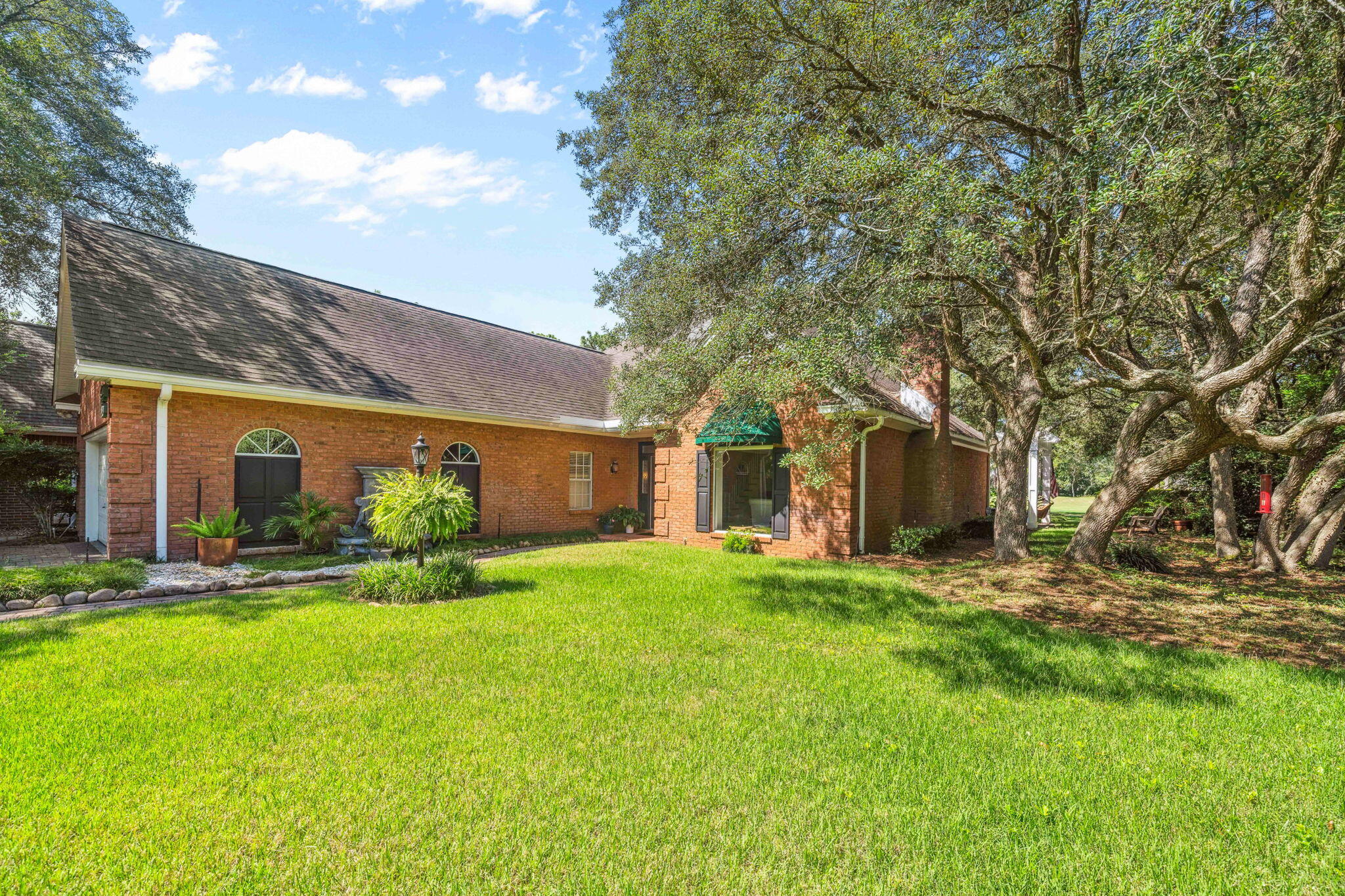 LOCATION, LIFESTYLE, & GOLF COURSE VIEWS! This spacious 2-story home is perfectly located at the end of a quiet cul-de-sac in the heart of BLUEWATER BAY. Set on an oversized lot backing directly to the golf course, this former spec home features expanded dimensions and thoughtful design throughout. Soaring vaulted ceilings and an open floor plan fill the interior with natural light. The large living area flows into a formal dining room and a cozy den just off the kitchen--ideal for both entertaining and everyday comfort. Enjoy your mornings with views of the fairway or take a quick golf cart ride to the marina, tennis courts, or nearby dining. Private paver driveway, mature trees, and unbeatable access to all the amenities Bluewater Bay offers. This isn't just a home--it's a LIFESTYLE!