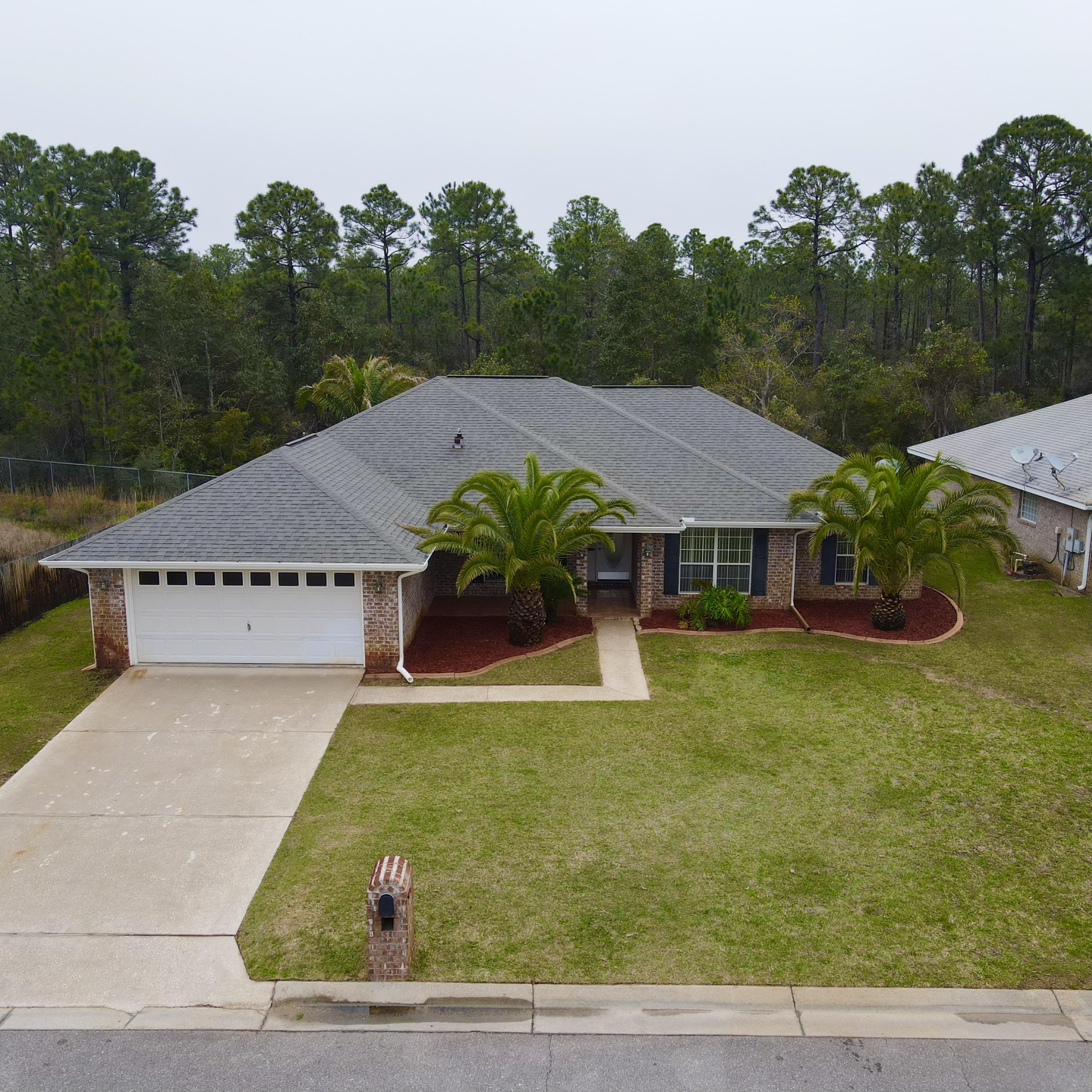 Welcome to this beautifully maintained 4 bed/2 bath 2281 sqft brick home, featuring a generous living space, dining room, large office/bonus room, and screened in porch. There are tile floors throughout, a brand new dishwasher, new HVAC in 2015, new stove in 2017, 2015 water heater, and fresh paint. Backed up to the woods with only one neighboring home, the backyard has a very private feel. This home is situated in close proximity to Hurlburt Field and beaches.