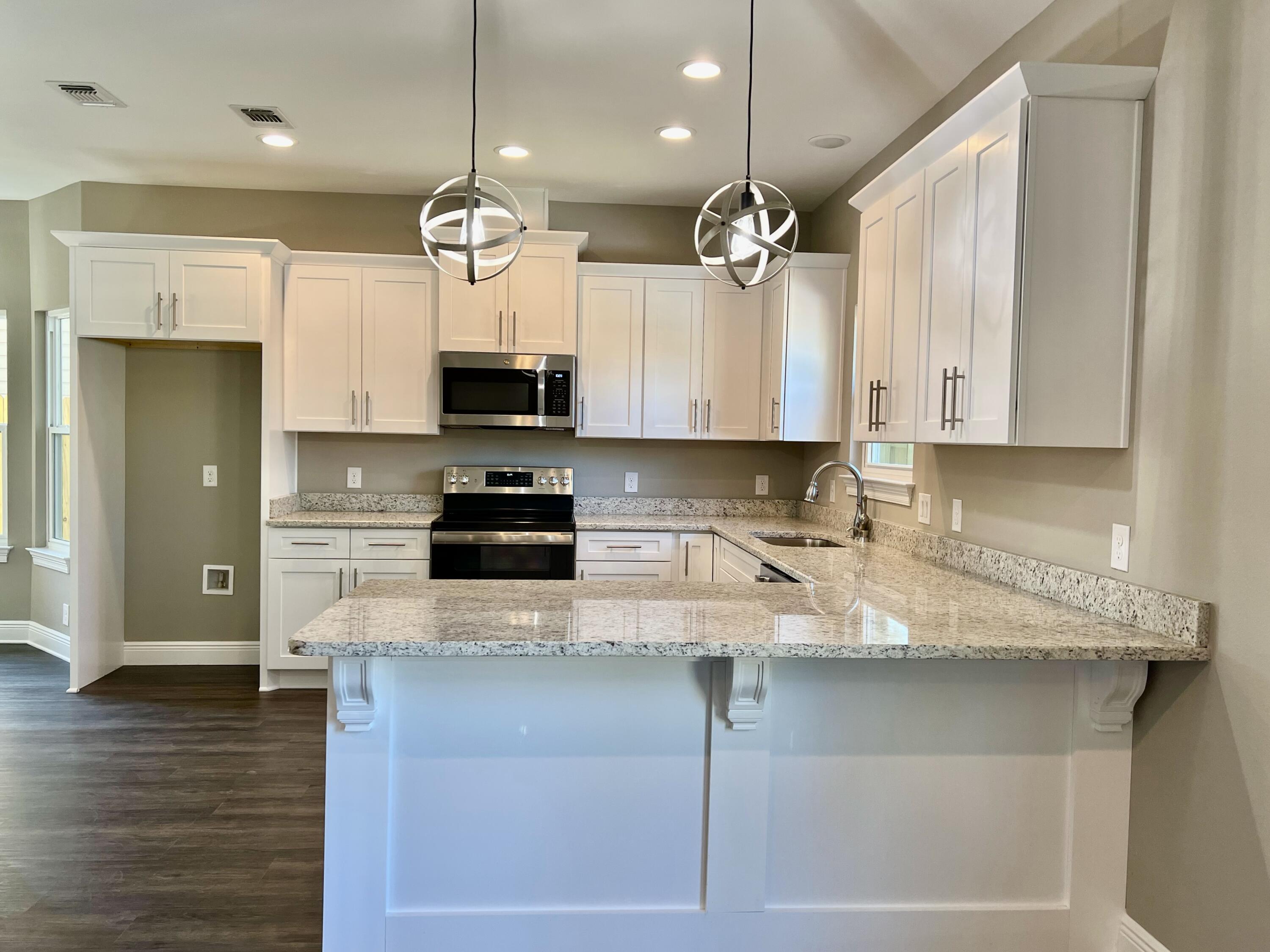 NEW CRAFTSMAN Custom Built Home in EAST NAVARRE~ Under construction and ready for move in ~Great Location with easy access to Navarre Beach ,local stores & Hwy 98 to Hurlburt Field AFB.This Stunning Robbins Builders Home offers trend setting Features~Greeted by a walk in foyer sweeping through to your open floor plan~Large kitchen enjoying all wood white Shaker cabinets with crown molding, beautiful GRANITE counter tops~Under mount sink~S/S appliances~Center Island or breakfast bar ,offering plenty of work area & open flow to the dining area and large family room.Gorgeous luxury vinyl plank flooring throughout. Master bedroom is a great size with & Large Master bathroom offering ~ oversized TILED walk-in shower ~Granite vanities with rectangular under mount sinks
