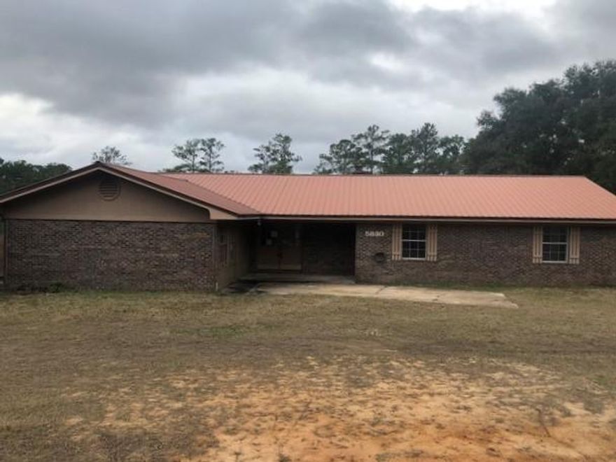 Real Estate Owned REO. Privacy, mostly brick exterior overlooking nearly 880 yards of breath-taking wooded nature trails with man-made bridges over babbling brooks. You enter the long circular driveway from county maintained paved road. 3 bedroom, 2 bath home. A large floor to ceiling brick fireplace further enhances the beauty of the living room. You'll enjoy the ranch-style atmosphere of the kitchen/dining area, and appreciate the privacy of the large family room. Located only 37 miles from the beautiful Okaloosa Island beaches of the Gulf of Mexico, and 27 miles from Eglin AFB West Gate.