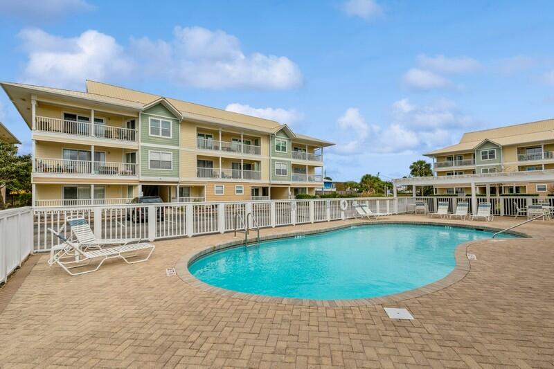 This is a top vacation destination! Just steps from Destin beaches that is accessible by a private boardwalk. This top floor unit looks out towards the Gulf of Mexico to catch the best sunsets as well as overlooks the common area. On site you have a gated pool with restrooms, lounge chairs and picnic tables with grills. In the immediate area you can explore shopping, dining and the crowd pleaser water park Big Kahunas. This property is fully furnished, turnkey and rental ready. Fully furnished and already has established rental history. Come see why this condo should be your next investment property