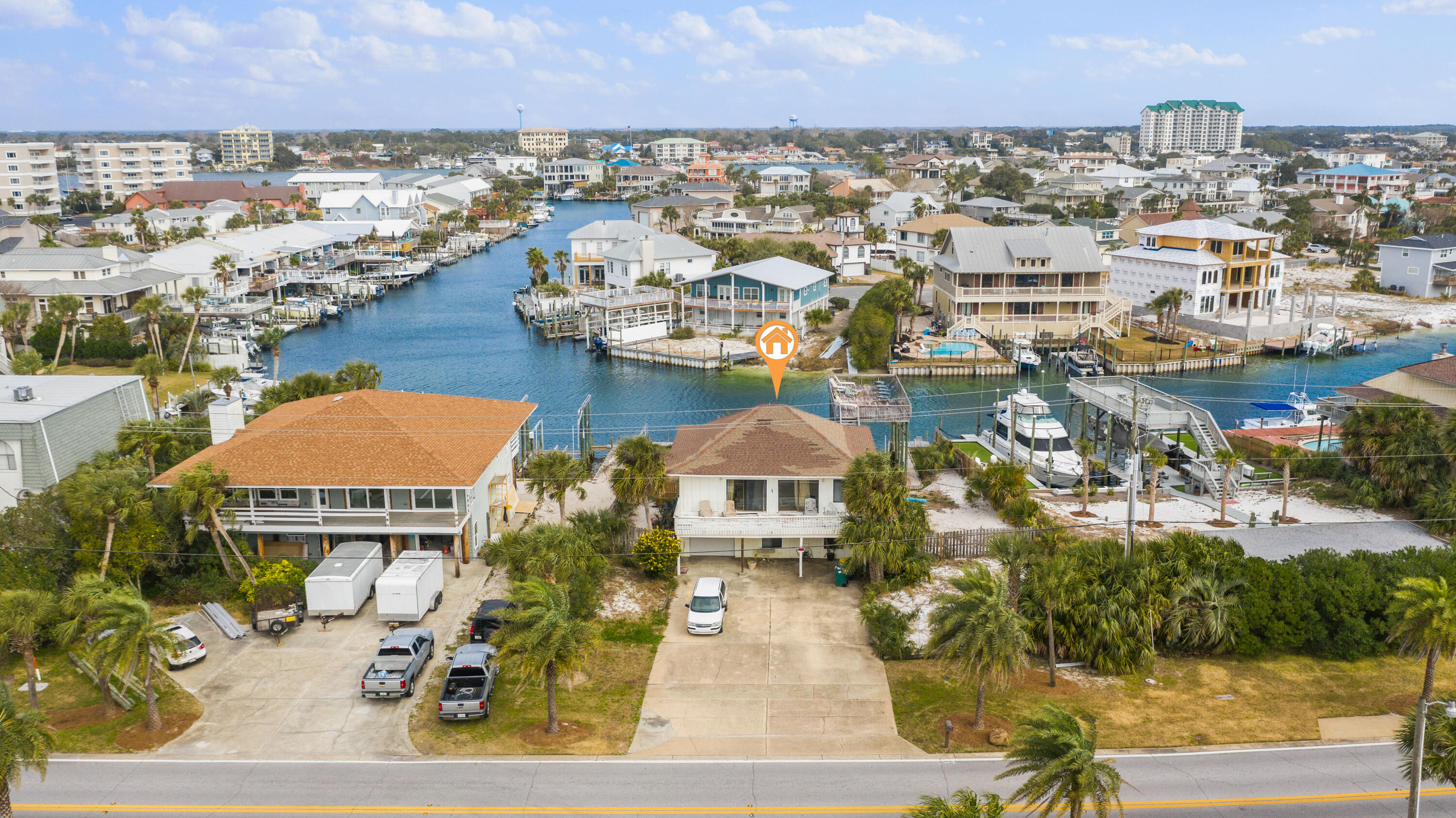 Fantastic opportunity to own an oversized deep water canal front property in the heart of Destin! 509 Gulf Shore Drive is situated across the street from the beach, and is a short walk, bike or golf cart ride to the neighborhoods deeded beach access. Perfectly situated in the turn of the widest canal in the harbor, the property offers a 35' alongside dock, and 2 separate upland slips complete with seawall that are able to accommodate boats in excess of 40'. This truly is an incredible opportunity to build your dream waterfront residence on this unique lot, or renovate the existing home and take advantage of everything Holiday Isle has to offer. Buyer must verify all information and specifications.