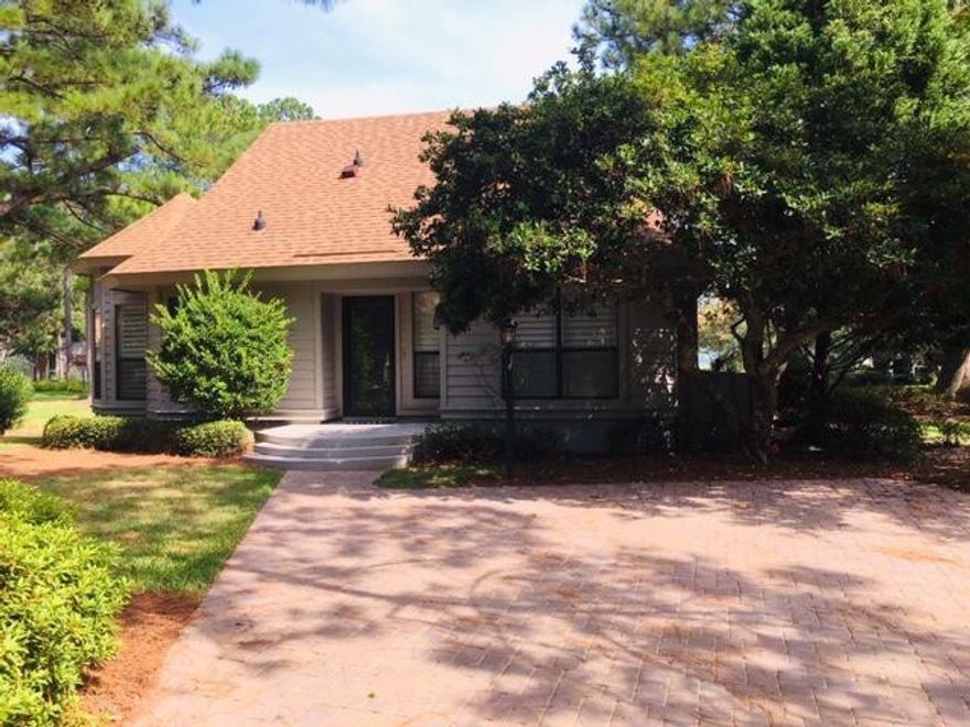 Peaceful setting, lovely views, updated home inviting you to enjoy lake views from the attractive screened porch and deck. A balcony view is also enjoyable from the second floor bedroom. Complimenting the views with Attractive Plantation Shutters. Sold Furnished (with a few listed exceptions). In 2015, Replaced Hot Water Heater, all ceiling fans, light fixtures, all bathroom toilets, vanities, shelves and racks~ Popcorn Ceilings REMOVED~ Shiplap instead of mirrored walls~ wood flooring throughout first level and painted interior. In 2017, Driveway expanded and pavers installed to accommodate 2 cars plus golf cart. In Oct 2018, exterior painted (6 yr HOA repainting cycle) - All soft wood replaced per HOA specs.