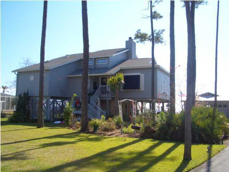 Elevated waterfront with magnificent Bay views! Endless open water views that seem to go on forever! This amazing 3 bedroom 2 1/2 bath home is a water lover's paradise! Built on pilings, the main living floor is about 13' above sea level. From this vantage point the views are even more spectacular. The living room has a vaulted ceiling, brick fireplace, and French doors that lead out to a fabulous screened in deck, perfect for entertaining. The very efficient kitchen has ample storage space, & opens to the breakfast nook. The breakfast nook has a wall of windows that look out over the Bay, and an additional screened in porch, ideal for early morning coffee or late night star gazing. New hot water heater, Generac Generator, Monitored security system, and landscape lighting.