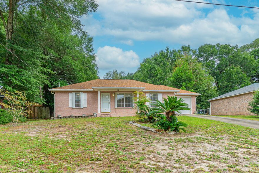 Welcome to 117 Jeff Drive, a well- maintained single-family home built in 2001, offering 1,107 square feet of living space on a spacious 0.26-acre lot. The home features permanently mounted hurricane shutters and energy-efficient double-pane windows for peace of mind and lower utility costs. Inside, you'll find a cozy layout with tile and carpet flooring, a bright living room, and an efficient kitchen equipped with electric stove/oven and refrigerator. The laundry room is adjacent to the kitchen washer, and dryer remain! The primary suite includes a walk-in closet and private bath, while two additional bedrooms offer flexibility for guests, home office, or hobbies. (click MORE) From the kitchen, step outside to enjoy the fenced backyard, perfect for pets or play, shaded by mature trees. The yard also includes two storage sheds. Crestview is a fast-growing community, gaining more amenities all of the time! It's close to Eglin AFB and Duke Airfield.